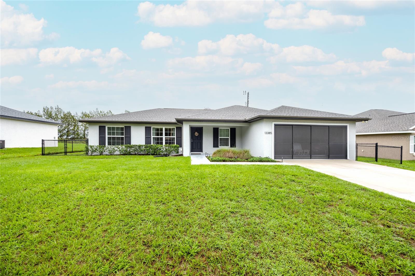 Discover this beautiful 4-bedroom, 2-bathroom home in the highly desirable Marion Oaks! Featuring an open-concept layout, this home is perfect for entertaining family and friends. The kitchen boasts sleek stainless steel appliances and elegant stone countertops, making it a chef’s dream. Enjoy low-maintenance living with luxury vinyl plank flooring throughout. The spacious 2-car garage offers ample room for parking and storage. Relax with your morning coffee on the screened-in back porch, overlooking a fully fenced backyard—ideal for pets and outdoor fun. Don’t miss out—schedule your private showing today. This one won’t last!