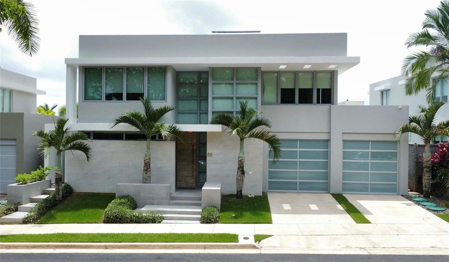 For rent in the exclusive community of Senderos de Montehiedra / Montehiedra West: a stunning 4-bedroom, 3.5-bathroom home offering 3,700 ft² of modern, functional living space on a 488.93 m² lot. This elegant residence features a luxurious primary suite with a custom California Closets walk-in closet (with its own A/C) and private terrace, a versatile flex room perfect for a gym or office, and a fully equipped kitchen with high-end appliances including a refrigerator, stove, microwave, dishwasher, freezer, garbage disposal, and two wine/beverage coolers. The home is fully air-conditioned, with a central inverter A/C on the main floor and individual units in all bedrooms and key areas. Outside, enjoy a saltwater pool with heating system, firepit, built-in BBQ bar, beverage center, ice maker, and a green wall for a modern touch. The property includes a 30 kW diesel generator, 34 solar panels with 40.8 kWh battery backup, solar water heater, and two 600-gallon cisterns. Located in a gated community with double access control, residents also enjoy access to two activity centers, a gym, swimming pools, tennis, basketball, and volleyball courts, and a children's playground. This home is the perfect blend of luxury, comfort, and sustainability—ready to become your next home.
