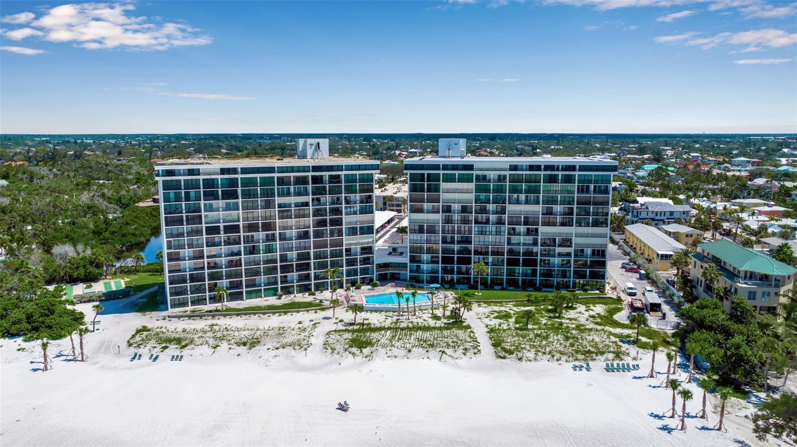 Opportunity Awaits with a Million-Dollar View! Imagine starting with a blank canvas and creating your very own slice of paradise—complete with private beach access and unobstructed Gulf views. Welcome to this light-filled 2 bed / 2 bath residence in the coveted North Tower of Whispering Sands, a premier 55+ Gulf-front community. Perfectly perched on the 2nd floor, this home captures sweeping vistas of shimmering turquoise waters, sugar-white sands, endless sky, and lush tropical greenery. Step onto your private balcony—accessible from both the living room and primary suite—and be mesmerized by the soothing rhythm of the surf and the kaleidoscope of Florida sunsets that paint the horizon each evening. This is your front-row seat to the Gulf Coast lifestyle. Dream away!