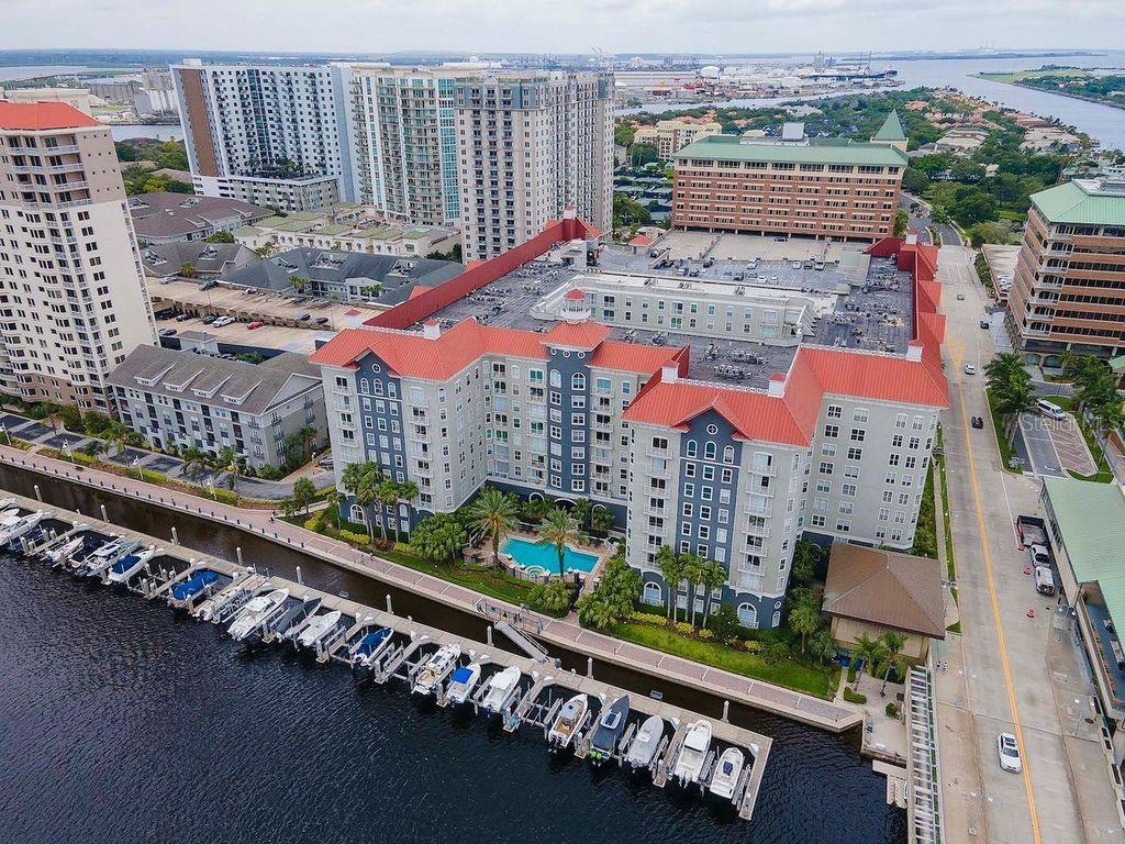 Experience resort-style living in the prestigious Parkcrest Harbour Island Condominium, where luxury and convenience meet in the heart of Tampa! Milestone inspection successfully completed in 2022!! This well maintained 4th-floor condo offers a spacious open floor plan, view of the city and a glimpse of the water taxis and more. Two bedrooms and two bathrooms.! The kitchen features granite countertops, stainless steel appliances, a pantry, and a large island perfect for casual dining or entertaining. A nearby laundry room provides additional storage space for added functionality. The sunlit living area is designed for comfort, featuring elegant crown molding, an upgraded ceiling fan, and plenty of room for a dining table. Whether hosting guests or unwinding after a long day, this space offers both style and relaxation. The primary suite is a private retreat, complete with two closets (including a walk-in) and a luxurious en suite bath featuring granite countertops and a deep soaking tub. A second spacious bedroom and full bath on the opposite side of the home provide the perfect setup for guests or a home office. Enjoy top-tier community amenities, including Concierge service & 24-hour security, Resort-style waterfront pool & spa, State-of-the-art fitness center, Business center, billiards room & resident lounge and a Tranquil courtyard for relaxation. Located along Garrison Channel, Parkcrest is within walking distance to everything Tampa has to offer— Bayshore Blvd, Tampa River walk, Sparkman’s Wharf, Amalie Arena, Water Street, Tampa General Hospital, the TECO Street Car, Cross Bay Ferry, and an array of top restaurants, entertainment venues, and museums. Don’t miss this opportunity to live in one of Tampa’s most desirable communities! Schedule your private showing today. Parking Space #436 on the 4th Floor.