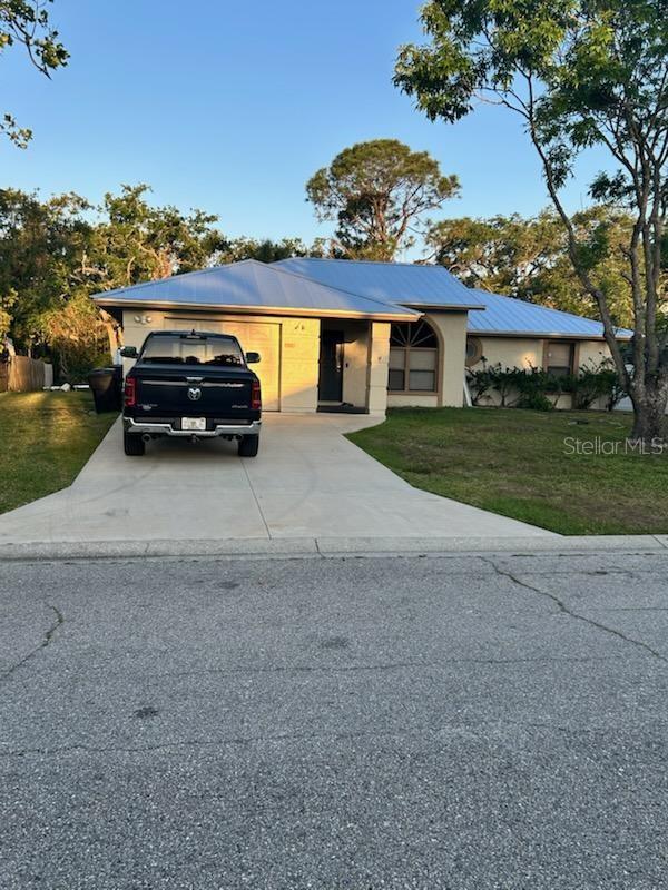 This well-maintained home is currently being used as a vacation rental and is in excellent condition. The roof is new this year in 2025, A/C unit new in 2024, and the range and refrigerator were new in 2023. The bedrooms have newer wood laminate flooring installed in 2023 and ceramic tile throughout the remaining living areas. The home has a split plan with 3 bedrooms and 2 bathrooms. The utility area has been enclosed and separate from the garage. The yard has a combination of vinyl privacy fencing and chain link backing up to a green space with no rear neighbors. The neighborhood is well established and conveniently located. There is an area fenced off in the back to park a boat, trailer, or RV. This home would be great for a family, retiree, or another investor looking to continue renting short or long term.