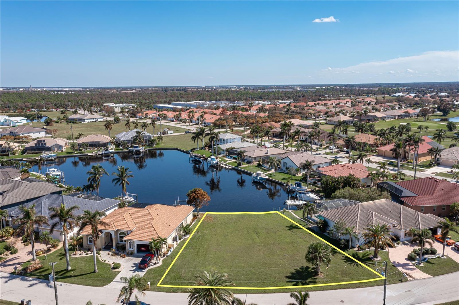 VACANT LOT IN BURNT STORE ISLES - Rare opportunity to have the best of everything with this lot...expansive view of a large canal basin, oversized dimensions & sailboat access. Lot is located on a quiet street & is surrounded by beautiful, custom-built homes. Build your dream home here & be welcomed by all of the wonderful neighbors. Catch a glimpse of the manatee that are often found in the canals. 127ft of road frontage allows you to build a home w/a large, 3-car garage. 96ft of seawall & a large turning basin provide easy access to your future dock. Burnt Store Isles is a deed-restricted, waterfront & golf community. Easy access to US41, I-75 & Burnt Store Rd allow you to reach Ft Myers, Cape Coral & Sarasota effortlessly. Enjoy boating from your backyard & golf right around the corner. Twin Isles Country Club is located in the center of the community. Practice your short & long game, brush up on your tennis strokes or simply enjoy the social setting. Burnt Store Marketplace anchors BSI offering a Publix, Home Depot & several other shops & restaurants. Get all our shopping done without leaving the neighborhood! Take advantage of the active lifestyle available here in Punta Gorda by enjoying the numerous walking & biking trails as well as the many waterfront parks offering everything from playgrounds to pickle ball courts.