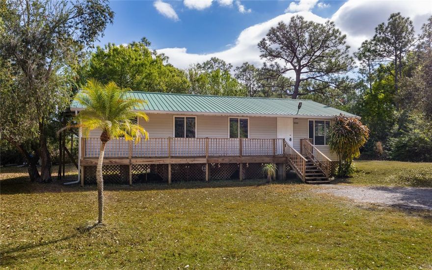 Indulge in the charm of country living with this HIGH AND DRY 3-bedroom, 2-bathroom home in much desired rural North Fort Myers. This sale includes the 2 adjoining parcels (see photos) for a total of 1.58 ACRES. Tucked away in a secluded dead-end spot, offering all the privacy you desire. Recently completely remodeled with new kitchen, vinyl flooring, new well equipment and much more! Plenty of room to park your boat, RV, or toys. Close to shopping, restaurants, boat launches, parks, trails and 2 miles from I-75. Looking for even more land? Add an additional .61 acres with 9930 Councilor Listed separately.