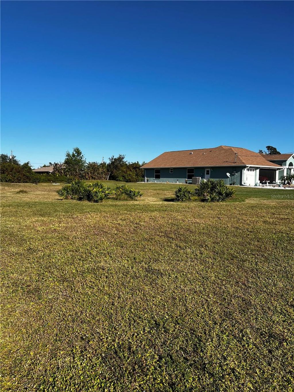 Photo of 671 Boundary Boulevard, Rotonda West, FL 33947 (MLS # C7501090)