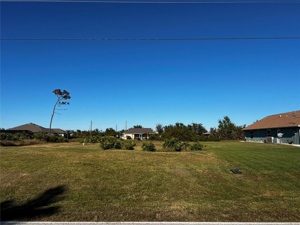 Photo of 671 Boundary Boulevard, Rotonda West, FL 33947 (MLS # C7501090)