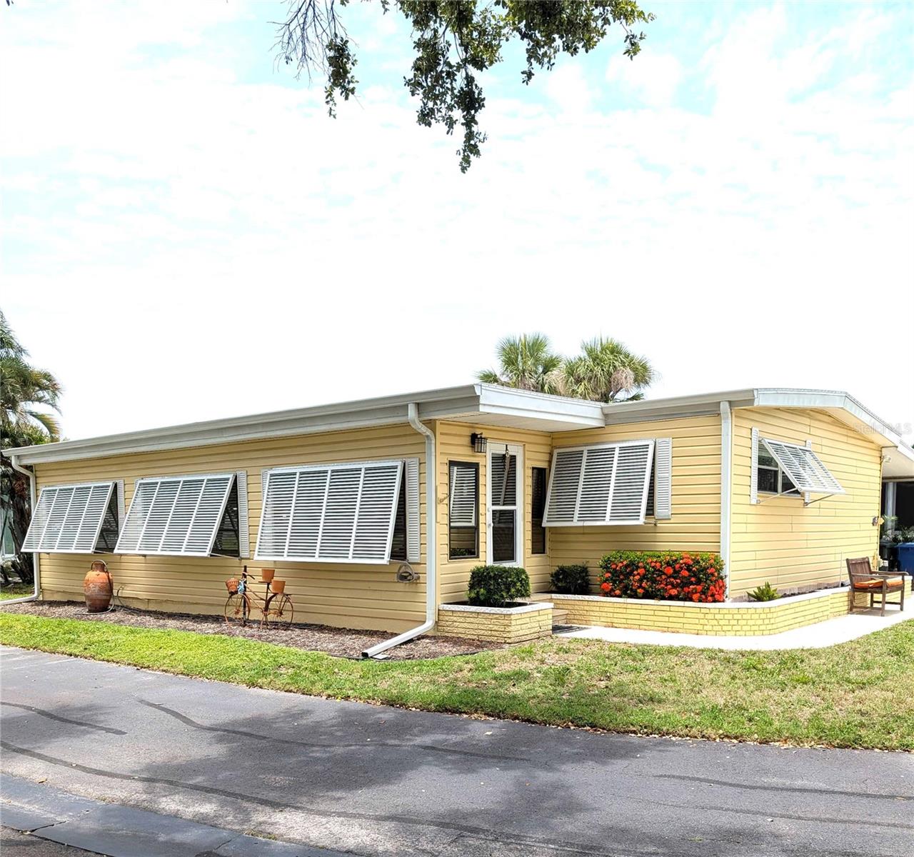 This price makes this a steal! This is a waterfront community. The home is located across the street from a parklike setting and on a corner lot, the privacy starts here! All of the high-ticket items have been taken care of. All new: roof, storm shutters, interior lighting, re-piped from main to all faucets throughout, sinks, toilets, hot water tank and heater. New electric panel in house and shed. Shed and workshop have new AC, Husky storage cabinets, toolboxes, and 2 workbenches. Updated kitchen and bathrooms! You will be amazed at how much open living space and storage there is. There is a large, screened lanai for that all important outdoor living.
This location is perfect! A wonderful and friendly community with a clubhouse, pool, tennis, shuffleboard and boat dockage.
See it soon. Priced to sell.