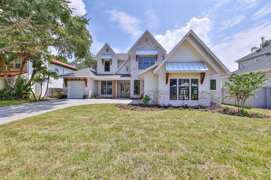 Under Construction. Experience a remarkable lifestyle when you reside in this stunning new construction South Tampa pool home. Situated in the highly sought-after Roosevelt, Coleman, and Plant school district, this exclusive Reflection Custom Home property boasts 4,429 SF of interior living space featuring 5 bedrooms, 6 1/2 bathrooms, media room, study & a 3 car garage on a 75 x 149 lot. A luxury landscape package, dramatic sloped roof lines and artful touches including gas lantern and rain chains invite you to explore the comfort and luxury that await inside. The airy foyer leads through to entertaining-sized living and dining rooms with views of the pool. The gourmet kitchen showcases modern style and comfort, with upscale Fisher & Paykel appliances, island seating, custom cabinetry, hidden pantry prep room, pass through window to outside cabana and an open flow to the family room with a 21' ceiling, custom beams and fireplace. The flexible 1st floor layout includes a lux primary suite with vaulted ceilings and artisan crafted pine beams, wifi enabled window treatments, spacious bathroom w/soaking tub and a large custom closet. A 5th bedroom, office, laundry room w/cubbies, butlery, powder bath & wine area complete the main level. The second level has the remaining 3 bedrooms, each have custom baths & generous closets, a media room plus a 2nd flr laundry room. The amazing rear property overlooking the pool and spa has a covered porch with stained wood tongue & groove ceiling, retractable screens, summer kitchen, pool cabana that has a full bathroom w/frameless glass shower enclosure & a 3rd laundry room. Additional upgrades include: Whole home generator, impact windows, in-wall pest tubes, Elan Smart Home System, smooth drywall, interior 8ft doors, crown molding, 22 Seer HVAC w/multi zoned control, Icynene R-21 spray foam insulation, speaker pre-wires, future elevator shaft, 2-10 Builder Warranty & so much more. Located minutes to iconic Bayshore Blvd., Crosstown Expressway, Tampa Intl. Airport, Downtown, 275, shopping & dining. Not in a flood zone. Estimated completion is September 2023.