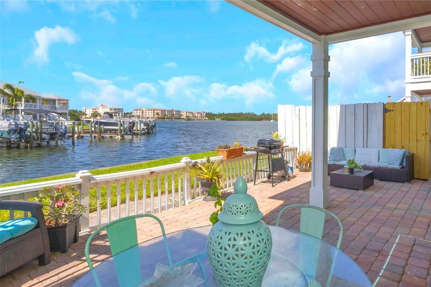 Amazing views from this waterfront condo in Waterside at Coquina Key! Enjoy stunning sunsets every evening! This 2 bedroom, 1 bathroom condo is extremely rare as it is a ground floor unit offering a large, private patio that looks out at the amazing open waters of the Little Bayou and Tampa Bay. This home provides a beautiful kitchen with stainless steel appliances, a washer and dryer, and an open layout with plenty of natural sunlight. Waterside is a highly-desirable community with resort-style amenities to support a fun and active lifestyle! The Yacht Club offers a stunning club house with open water views and your very own sports bar! Two pools and spas, a fitness center, tennis, volleyball, pickleball, shuffleboard, library, billiard room, dog park, miles of walking and biking trails, and much more! Boat slips are available for rent or purchase upon availability along with ample kayak and paddleboard storage. Meet the neighbors and get involved in fun activities and events such as live music, yoga classes, pasta nights, or Sunday Football! Located just minutes from Downtown St. Pete and beautiful beaches. Tampa International and Clearwater-St. Pete airports are less than 30 minutes away! You will love living in this beautiful home with your own private outdoor oasis, breathtaking water views, and fun coastal lifestyle!  **Furniture can be included in the sale price**