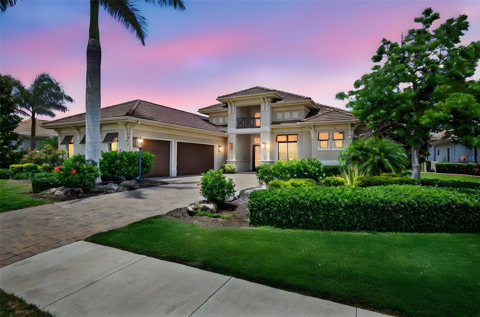 Welcome to the only Stock Luxury Home currently available in Esplanade Golf & Country Club—ideally situated on the 7th fairway with sweeping golf course views. This barely lived-in Madison II model boasts 4 spacious bedrooms, each with its own en-suite bath, plus a dedicated office with French doors and an elegant powder room—offering 4.5 baths in total. Step inside to discover a gourmet kitchen featuring quartz countertops, designer backsplash, GE appliances, and an open-concept layout perfect for entertaining. The expansive great room is anchored by pocket sliding doors that seamlessly lead to the extra-large panoramic screened lanai (856 sq ft) with partial pond views. The dining area features corner sliders for added indoor-outdoor flow. The luxurious primary suite offers French doors to the lanai, custom his & her closets, dual vanities, a freestanding soaking tub, and a walk-in shower. Additional features include a large laundry room with custom cabinetry, 8-ft doors, ceiling fans in guest rooms, hurricane impact windows throughout, blinds on all windows, custom closets throughout, a full-house surge protector, and a three-car garage with epoxy flooring. Outside, enjoy a Pentair pool and spa with LED color-changing lights, plus a pool bath with exterior lanai access. Every detail was thoughtfully selected to provide comfort, elegance, and efficiency. Enjoy the Esplanade lifestyle with bundled golf, resort-style amenities, and a vibrant community atmosphere. Esplanade offers a wide array of amenities and activities such as an 18-hole championship golf course, two resort pools, hot tubs, resistance pool, pickleball, tennis, bocce ball, two fitness centers, exercise classes, two dog parks, playground, firepit, spa/salon, an on-site lifestyle director, social events, and various clubs plus a Tiki bar. The state-of-the-art Culinary Center offers residents several dining options such as the Barrel House, wine tastings, and special events. Esplanade is located in the heart of Lakewood Ranch, close to I-75, Lakewood Ranch Main St., University Town Center, Sarasota Polo Club, shopping, dining, entertainment, hospitals, cultural attractions, boating, parks and Florida's famous sandy beaches.