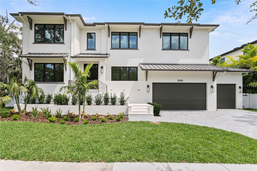 This newly constructed home is the product of a remarkable collaboration among three renowned South Tampa builders—Halo Homes, Hooter Construction, and Baylife Homes. Their collective skills have resulted in a luxurious residence that sets a benchmark for contemporary living in Sunset Park. The home was carefully designed using cutting-edge construction methods, including Two story block construction with no wood on exterior walls. 
Every detail throughout the property is meticulously executed. The professionally landscaped exterior offers a paver driveway, sleek stucco finish, 30-year dimensional shingle roof, bronze gutters, and a marble-accented front porch. Indoors, you'll find 10- to 10-foot 8-inch ceilings, , top-tier drywall finishes, and single-panel 8-foot solid core doors, all contributing to a refined ambiance. Engineered hardwood floors extend through the main areas, enhanced by elegant, coffered ceilings. The open-concept design centers around a spectacular kitchen equipped with custom cabinetry, level 6 quartz countertops, a full-height quartz backsplash, pot filler, and a professional Thermador appliance suite—cooktop, double ovens, a microwave drawer. A walk-in butler’s pantry adds practicality and sophistication, showcasing LED-lit white oak floating shelves and dual 24” beverage/wine refrigerators.
Seamless indoor-outdoor living is made possible by a 16’ impact-rated sliding glass door that opens onto a marble-clad lanai, which includes an outdoor kitchen with marine-grade cabinetry, Artisan gas grill, beverage fridge, stainless sink, and outdoor speakers. The backyard features a resort-style pool, spa, and sun shelf—ideal for entertaining any time of year.
A elevator provides access to all levels, The expansive primary suite offers soaring ceilings, a private beverage center, and a resort-inspired bathroom complete with dual vanities, designer marble accents, a soaking tub, spacious walk-in shower, and two built-in closet systems. Secondary bedrooms each come with their own walk-in closets and en suite baths. Additional spaces include a second-floor loft, laundry room, media room, and dedicated AV closet, Further amenities comprise two Navien tankless gas water heaters, high-efficiency Carrier HVAC systems controlled by Ecobee smart thermostats, Gyp-Crete fire and sound protection, and in-wall pest control tubes. The oversized four-car (two-car tandem) garage completes the package.
Step inside to experience a modern transitional interior where sophistication meets practicality. The open floor plan highlights engineered hardwood flooring, bespoke cabinetry, and Thermador appliances set beneath impressive high ceilings. Spacious common areas transition smoothly to a marble-covered lanai, leading out to the pool and large backyard that's ideal for quiet relaxation or social gatherings.
Perfectly nestled near top-rated schools and the best of South Tampa’s neighborhoods in Sunset Park close to airport, restaurants, and countless amenities, this residence is more than just a showcase of cutting-edge construction and fine materials—it’s a place where unforgettable memories are waiting to be made. With a harmonious blend of comfort, elegance, and enduring quality, this home is ready to welcome you for a lifetime of inspired living.