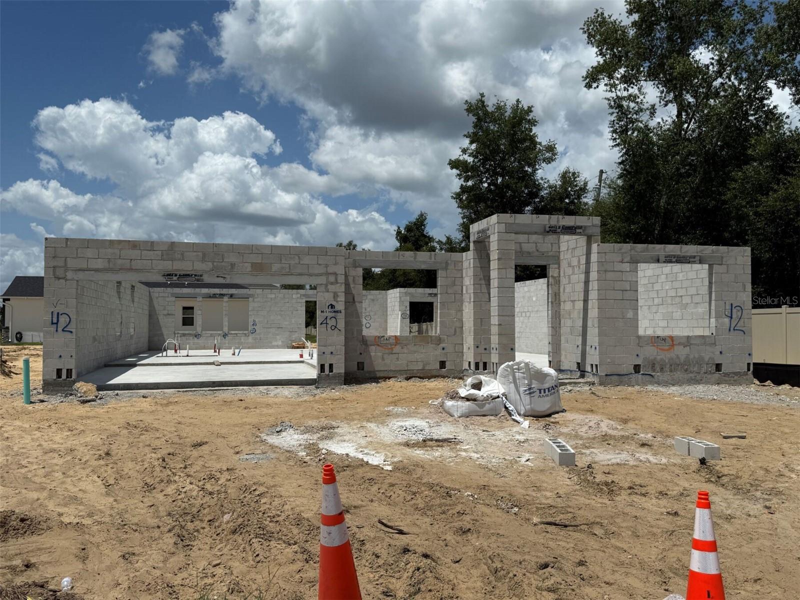 Under Construction. Discover this stunning new construction home at 699 Pointe Emerson Boulevard in Apopka! This thoughtfully designed home offers 4 spacious bedrooms, 3 well-appointed full bathrooms, an open-concept living space perfect for entertaining and daily family life, a 31' x 12' lanai, a 2-car garage, and more. The open-concept living space creates a natural flow between rooms, making it perfect for both relaxation and hosting guests. The owner's bedroom on the main floor adds convenience and accessibility, while the additional bedrooms provide flexibility for family needs, guests, or home office space. This home is ideally situated in a desirable Apopka neighborhood known for its proximity to beautiful parks and recreational opportunities. The area offers easy access to outdoor activities while maintaining the peaceful atmosphere families seek. As a new construction home, you'll enjoy the peace of mind that comes with contemporary building standards and energy-efficient features. This home represents an exceptional opportunity to own a quality new construction home in one of Apopka's most sought-after neighborhoods.