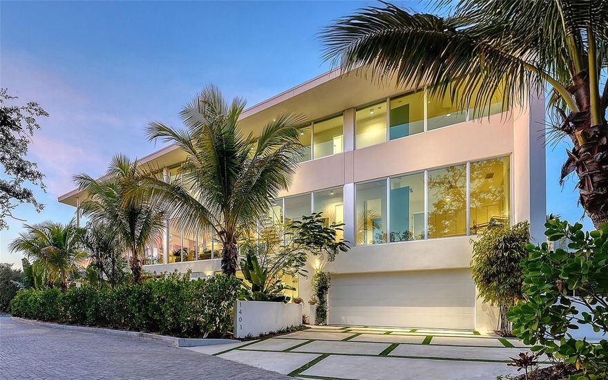 Tucked behind the gates of Oyster Bay Landings, the only gated community in Oyster Bay Estates, this one-of-a-kind 2024 Sweet Sparkman–designed residence offers exceptional privacy and boating access in a premier West of Trail location. One of just 12 homes in this intimate enclave, the property includes a deeded boat dock along a protected cove on Roberts Bay with dual water inlets leading directly out to the bay. At the end of a quiet dead-end street surrounded by boatable water, the 4,042-square-foot residence (6,678 square feet  total) features clean-lined contemporary architecture, floating stairs with glass railings, an elevator to all levels and walls of glass that fill the interiors with natural light. Premium finishes include a custom European kitchen with DOCA cabinetry and porcelain countertops, LED lighting throughout, motorized shades and a whole-house generator. Balconies on second and third floors frame views toward Roberts Bay. The West of Trail address places you close to the best of Sarasota. The Field Club is within short distance, Publix is one mile away, Sarasota Memorial Hospital is only two miles north, downtown Sarasota is about three miles, and Siesta Key Beach, with its world-famous white quartz sand, is only five miles from your door. A unique, modern, coastal home with gated privacy, waterfront access and everyday convenience in one of Sarasota’s desirable neighborhoods. Inquire about the adjacent lot to the west, an opportunity to expand or create a private estate compound, while preserving uninterrupted waterfront views.