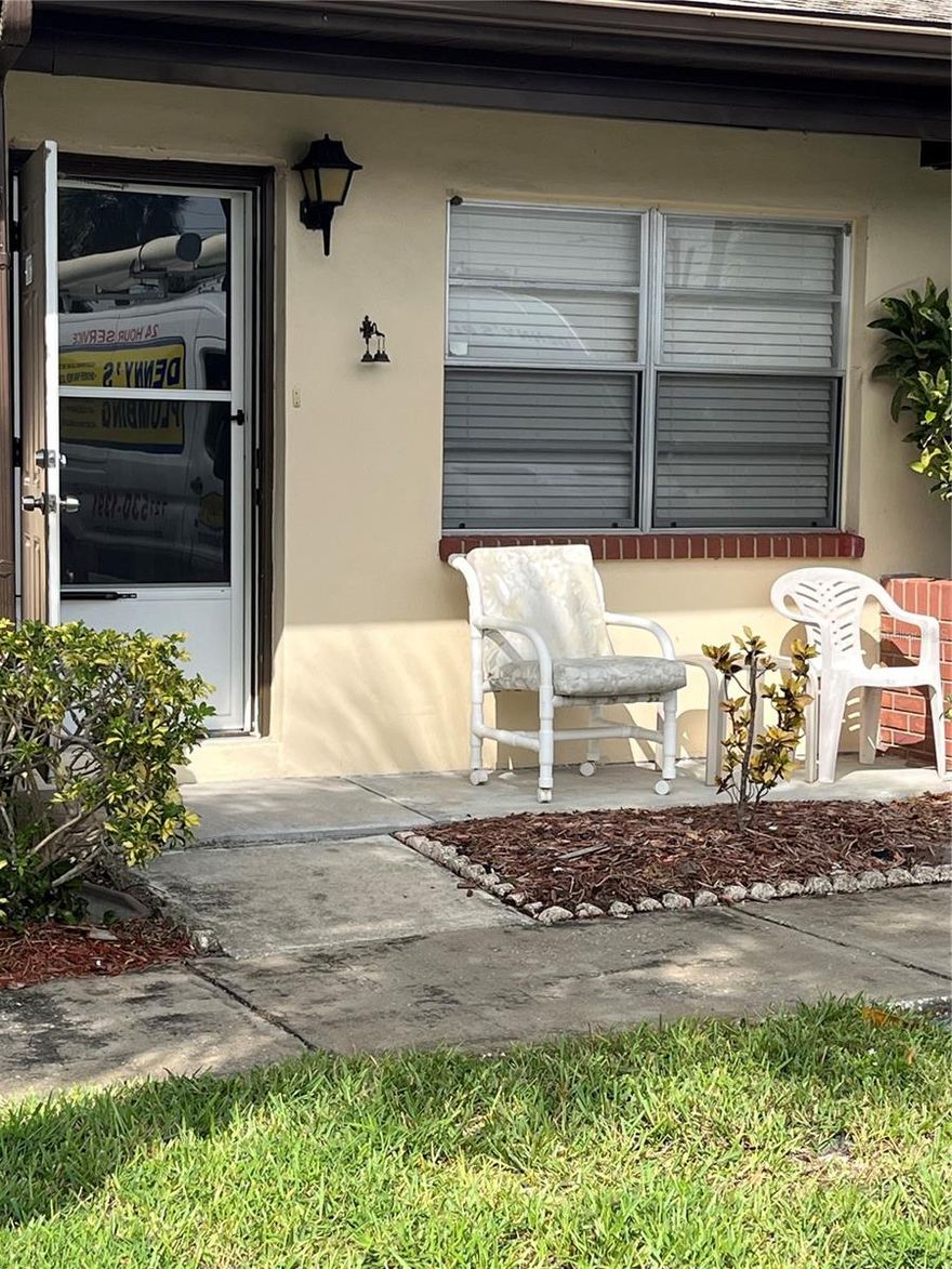 PET FRIENDLY COMMUNITY.  Welcome to HILLCREST VILLAS where all units are single story.  No high rise and no upstairs neighbors. Fully furnished, 1 bedroom, 1 bathroom condo. Your own covered parking spot right outside your front door. Invite your friends and relatives to visit as there are THREE sleeper sofas in this home.  Monthly HOA fees cover cable and internet.  
Newly installed heating/air unit and carpet in 2023.  Owner has installed full size washer/dryer in bonus room.  Bonus room is additional square feet from what is listed in legal records. This room has a sleeper sofa, recliner and desk with chair. 
Community pool, shuffleboard and car washing station.  
Short drive to beaches and two airports.   
One dog up to 25 pounds.  
 Conveniently located to medical facilities, restaurants and shopping. 
THIS IS NOT LAND LEASE.