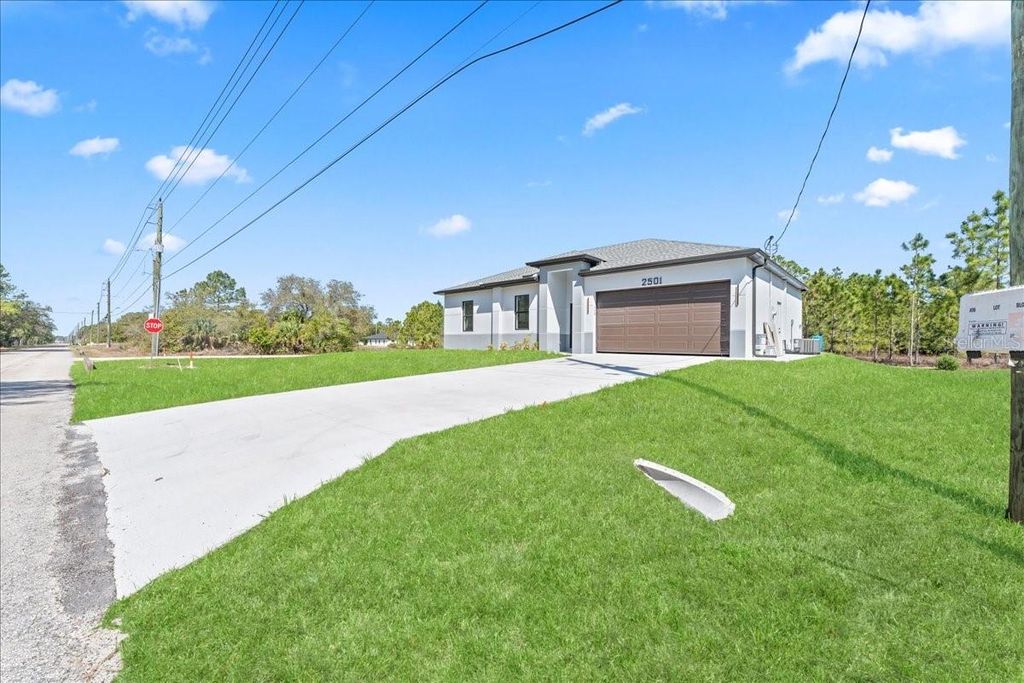 Photo of 2507 E 15th Street, Lehigh Acres, FL 33972 (MLS # A4688534)