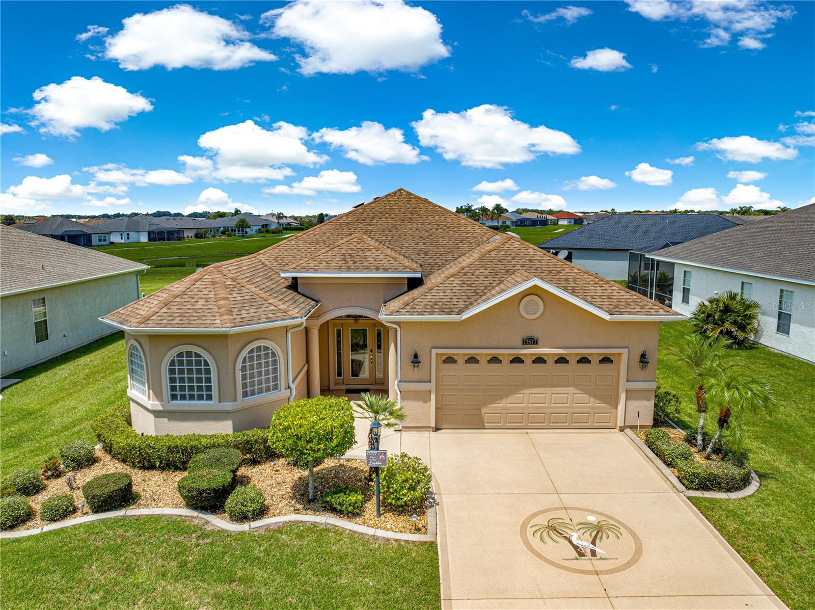 This home is located in the beautiful 55+ gated community of Stonecrest. Stonecrest offers 4 pools of which one is a large In-door pool, newly equipped fitness center, great softball field, tennis, pickleball and many wonderful clubs for your enjoyment. You also will be 5 minutes from The Villages and all of their amenities. This 3/2 home offers granite counter tops, Brazilian Cherry Hardwood floors with tile in the wet area and Berber carpet in the bedrooms. There are newer stainless steel appliances, tiled walk in shower in the Primary. There are self close Cherry Cabinets in the kitchen. This Maple has a split floor plan, inside laundry double walk in closets and a 6 person Spa in the lanai with a privacy fence. Don't miss this wonderful home.