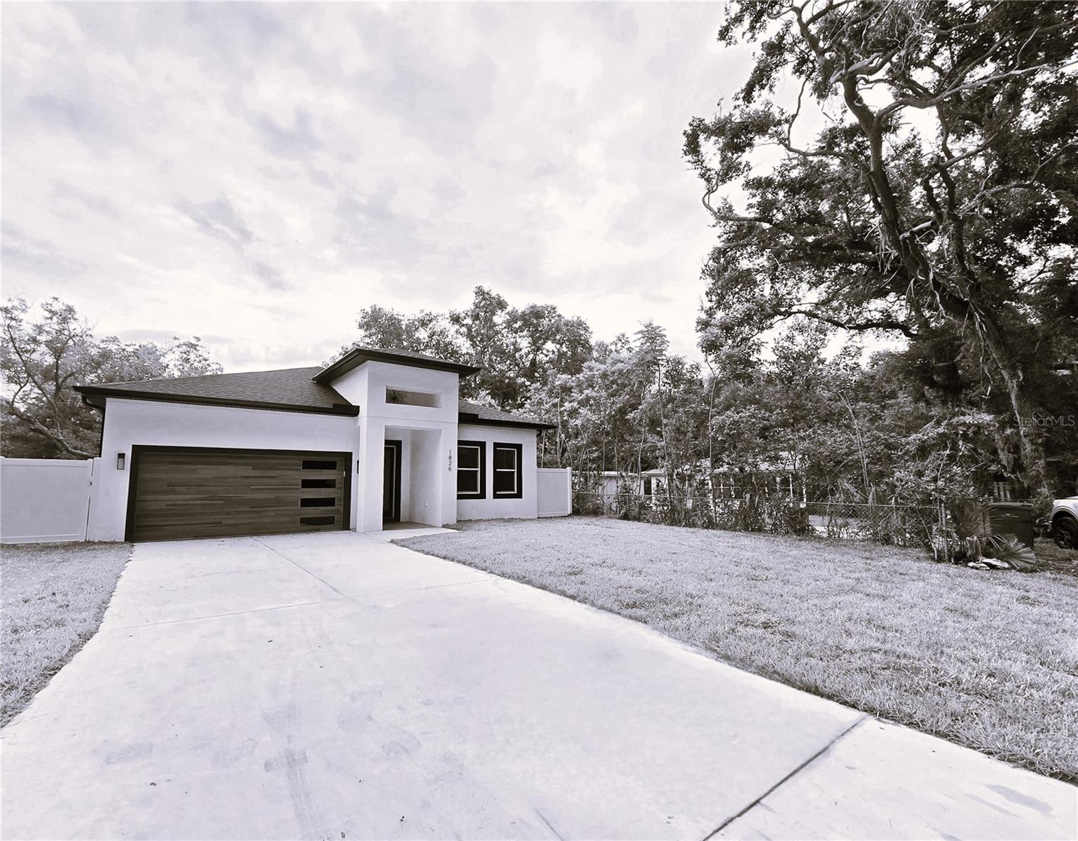 Under Construction. This can be your next home! No FLOOD insurance required & NO HOA. This Modern home is expected to be completed in September 2025. Its contemporary style invites you to enter through a stylish glass door you will discover an open bright split floor plan featuring beautiful vinyl wood style floors, a modern kitchen with oversized island blanketed with a stone countertop which flows like a waterfall down the sides. Additional features include stainless steel matching appliances, a closet pantry for additional storage, recess lighting, & custom vent hood. Imagine the gatherings & meals that can be prepared here. The open GREAT room has a tray ceiling with oversized fan and glass sliding doors that lead you to a private back porch and vinyl fenced in yard, the perfect place to relax and unwind. Double frosted privacy doors lead you to a study, a perfect place to have a home office. The rooms have power & cable outlets on the walls ready for the T.V s to be hung. Additionally, the master suite has a tray ceiling, an oversized walk-in closet, and an on-suite bathroom with tiled shower, seamless glass doors, modern tub and double sink vanity. Conveniently located on a quaint tree lined street near Downtown Clearwater, Historic downtown Dunedin, Seminole boat ramp and Top-rated Clearwater Beach. Final design and exterior finishes may vary. Inquires welcome for additional information.