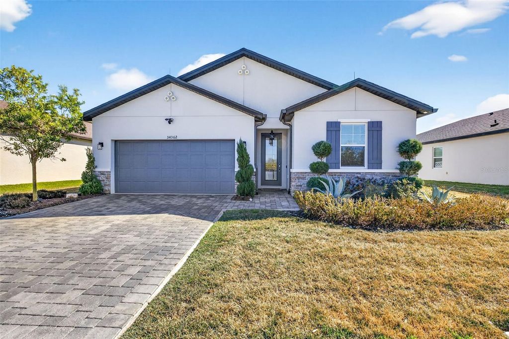 Photo of 34362 Wynthorne Pl, Wesley Chapel, FL 33545 (MLS # TB8465673)