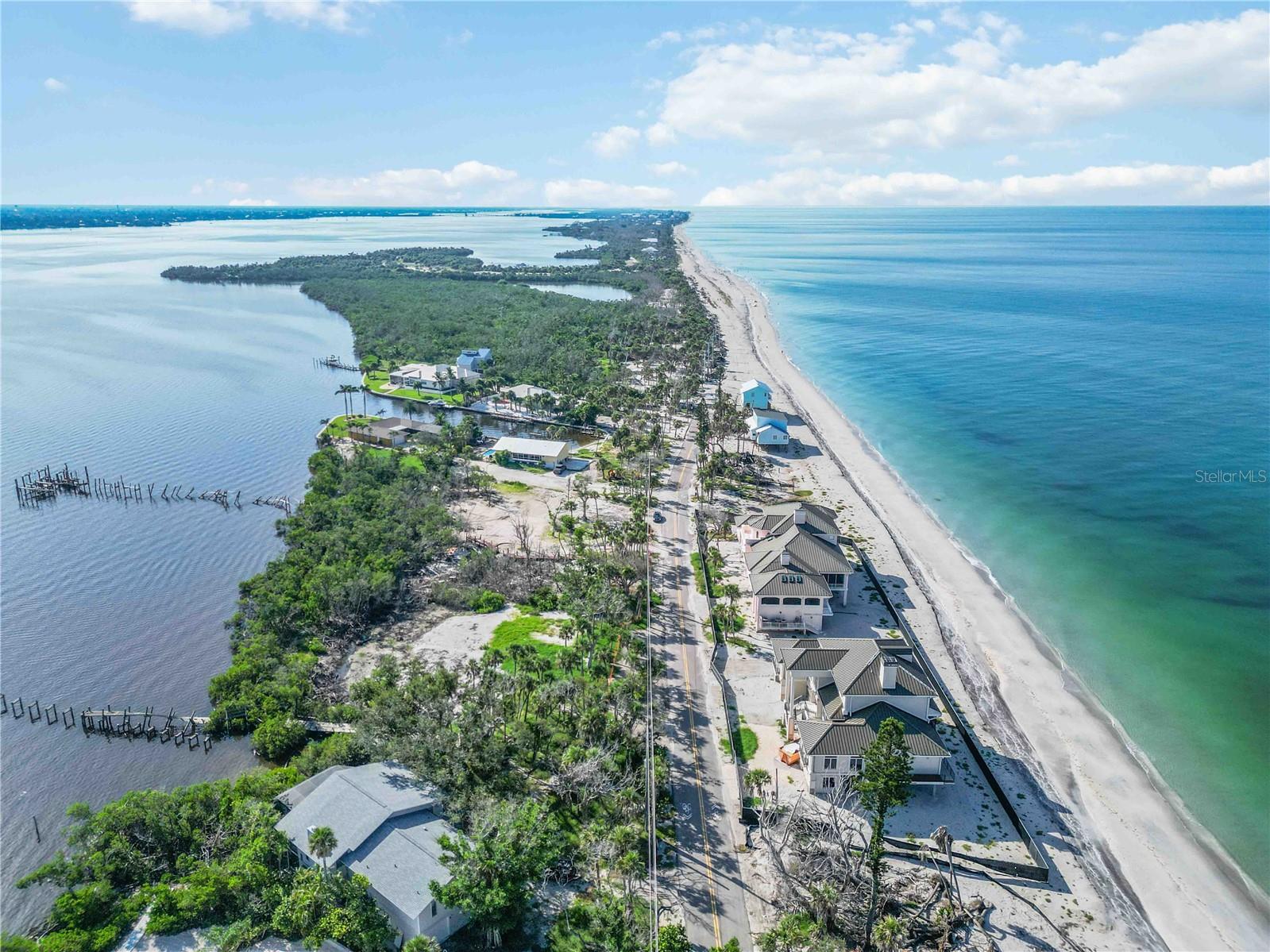 Prime Bayfront Lot on Manasota Key! Rare opportunity to own a spacious 2/3-acre waterfront property on the desirable bay side of the Key. Nestled in a private and quiet section just north of Middle Beach, this cleared and ready-to-build lot is surrounded by luxury homes, offering the perfect setting for your custom coastal retreat. Enjoy direct Gulf access with no bridges, plus the option to add a pier and boat docks for all your boating needs. Across the street, you’ll have a 5’ deeded beach access to pristine white sand beach on the Gulf, where you can soak in breathtaking sunsets and collect world-famous shells and shark teeth. A new survey has already been completed, and the location is second to none with new luxury estates being built nearby, ensuring strong future value growth. Don’t miss this rare chance to secure one of the few premier Bayfront parcels left on Manasota Key—where waterfront living and private beach access come together in one exclusive package.