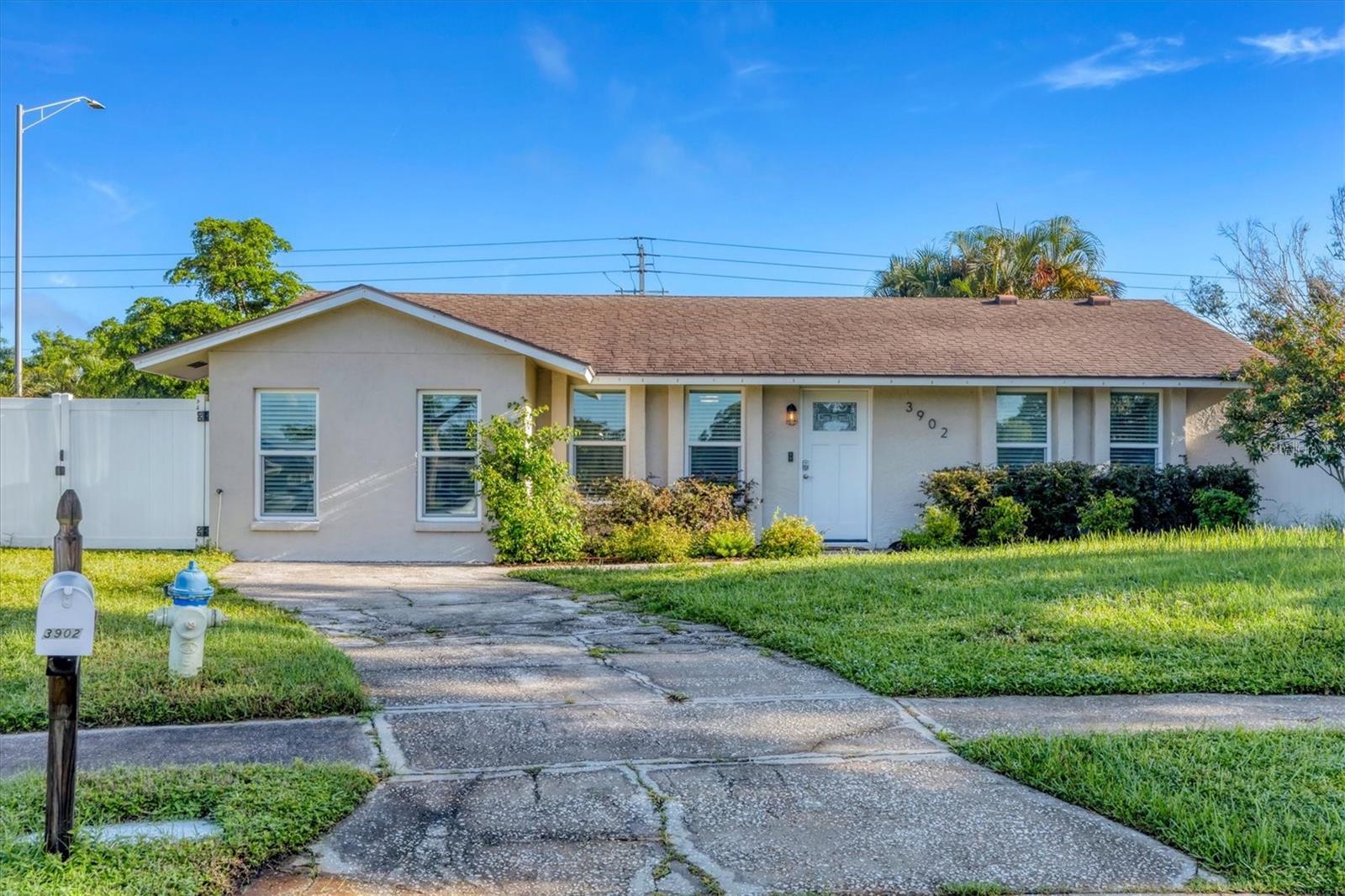 This gorgeous, completely remodeled home is a decorator’s dream, perfectly blending modern upgrades with coastal charm. Every detail has been thoughtfully updated and lovingly maintained. The open floor plan is ideal for gathering and entertaining and is infused with natural light. You'll love cooking in the chef's kitchen, with gorgeous quartz countertops and matching backsplash, new white cabinets, and coordinating stainless steel appliances & hardware. There is a reverse osmosis system connected to the kitchen sink and the large window makes the kitchen bright and cheery. The primary bath features a walk-in shower with natural stone mosaic floor tile & classic subway wall tile. The second bathroom has a tub/shower combo and matching finishes to the primary bathroom. The garage has been professionally converted into a 3rd bedroom with closet, windows, and a wall-mounted Mitsubishi Trane split AC/heat unit. Outside, you'll enjoy complete privacy with a white vinyl fence surrounding the property and mature areca palms. The side yard offers plenty of space to park a boat or trailer behind the privacy fence and there is an outside storage shed for your toys and equipment. Additional upgrades include: new electrical panel (2021), tankless water heater (2022), whole home re-plumbed, A/C (2016). All windows were replaced in 2018 and are very energy efficient. Fresh paint inside and out, and beautiful new landscaping. You'll love this quiet, established neighborhood with quick access to everything Sarasota has to offer. Just 1 mile to I75 and 15 minutes to Siesta Key. Don't miss your chance to make this beauty your new home!