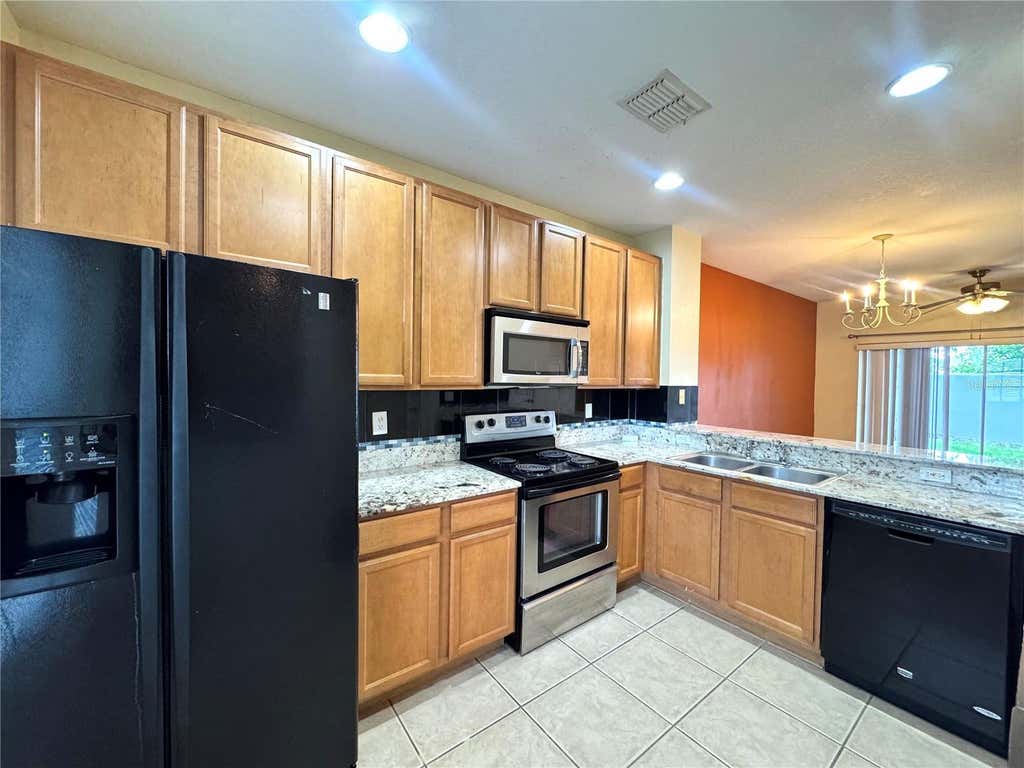 Photo of 10832 Savannah Wood Drive #134, Orlando, FL 32832 (MLS # O6431754)