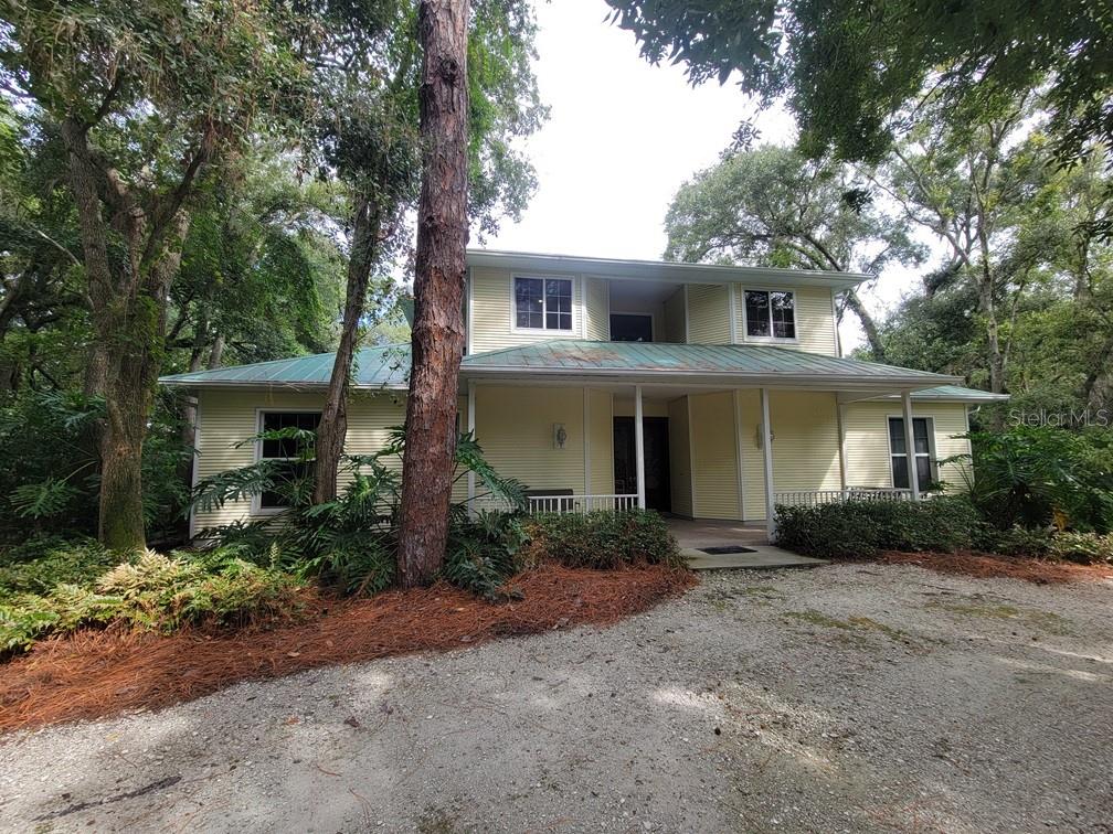 This stunning two-story, 4-bedroom, 4.5-bath pool home in highly sought-after Tarpon Springs is a true hidden gem and an absolute must-see! Tucked away behind a private gated entrance and surrounded by mature trees, the property offers total seclusion with no neighbors in sight. Inside, the spacious first floor features a 24-seat theater room perfect for movie nights, a versatile office/library with built-in shelves, a desk, and a Murphy bed, plus a luxurious owner's suite. The owner's retreat includes a cozy reading or craft nook, a large walk-in closet, and an expansive en-suite bath with dual vanities, a garden tub, and a separate shower. A double-sided propane fireplace connects two comfortable living areas, while a built-in bar with a wine cooler (note: refrigerant needed) makes entertaining a breeze. The chef’s kitchen is fully equipped with granite countertops, stainless steel appliances, a gas stove, double ovens, a hidden walk-in pantry, and a breakfast bar, all flowing into a formal dining space. A dedicated laundry room with washer, dryer, utility sink, and storage cabinets adds convenience. The main level also offers a full guest bath at the front of the home and a poolside half bath. Upstairs, you'll find three additional bedrooms, two guest bathrooms, and a bonus office space.
Step outside to your private backyard retreat featuring a large screened-in lanai, sparkling pool (spa excluded), outdoor shower, and plenty of space to lounge or dine al fresco. An impressive built-in fire pit with surrounding seating area makes for cozy evenings under the stars. The home also includes a 2-car garage (note: the third bay will be used for owner’s belongings). Located just minutes from pristine beaches, the famous Tarpon Springs sponge docks, top-rated restaurants, shopping, and more—this home blends luxurious living with unbeatable privacy and location.
Water, Sewer, Protane, Pool Maintenance and Lawn Maintenance INCLUDED in rent!