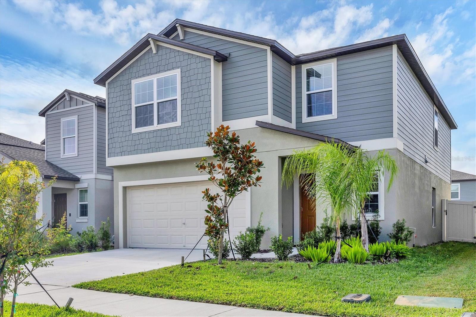 One or more photo(s) has been virtually staged. Welcome to your dream home! This spacious two-story home featuring 5 bedrooms and 2.5 baths is perfectly designed for comfort and modern elegance. Step inside to an inviting layout with ceramic tile flooring throughout the main living areas, kitchen, and bathrooms, offering both durability and style. As the heart of the home, the kitchen showcases sleek quartz countertops, abundant cabinetry, gas range, and stainless steel appliances. The kitchen’s open flow concept makes it ideal for entertaining or family gatherings. Each bathroom also features elegant quartz finishes, adding a touch of luxury to your everyday routine. Upstairs, you’ll find generously sized bedrooms providing space for everyone to unwind. Additionally, the upstairs offers a bonus loft serving as a flexible space perfect for a media room, playroom or home office. Step outside to a private fenced backyard, ideal for pets, play, or relaxing evenings outdoors. Located in Connerton, a master-planned community with exceptional amenities, playground, pools, parks, dog parks, trails and top-rated schools. This picture-perfect home embodies modern style, functionality and style— the perfect setting for your next chapter! One or more photo(s) has been virtually staged. MOVE-IN READY!