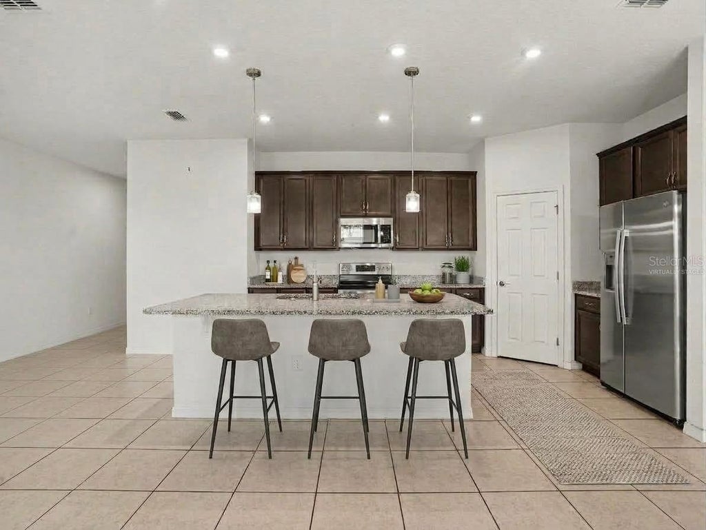 Photo of 1080 Patriot Loop, Haines City, FL 33844 (MLS # TB8549713)