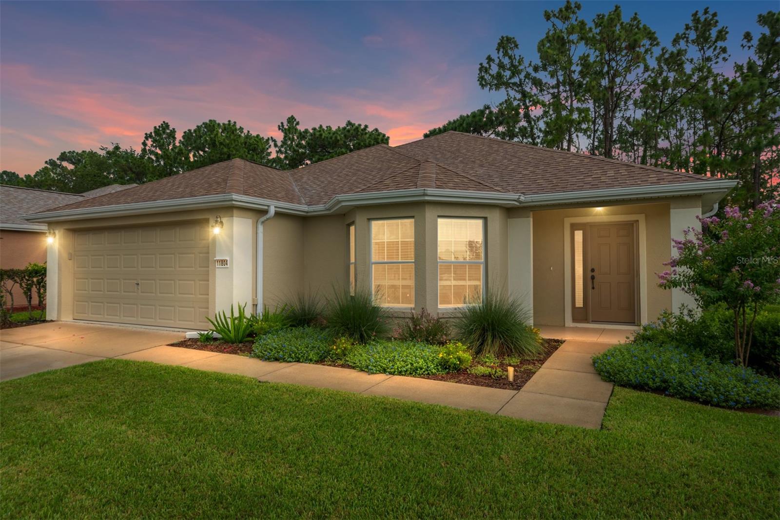 Great house-great location-great price-great condition! ROOF 2021, HVAC 2024, WATER HEATER 2025, NEW IRRIGATION CONTROLLER-NEW IRRIGATION BACK FLOW PREVENTER-NEW WASHER-NEW DRYER-NEW MICROWAVE-NEW RANGE-NEW DISHWASHER-NEW REFRIGERATOR-even NEW ELEVATED TOILETS! Not too big, not too small. A desirable CHALLEDON floor plan with a paver floored screened lanai, overlooks the beautiful private backyard which is large enough for a dog fence. The large eat-in kitchen with its Bay window features beautiful cabinets and appliances overlooks the living room, ensuring you are always part of the party. CROWN MOLDING. Vinyl floors throughout - NO CARPET! Located with convenient proximity to the North Gate in the neighborhood of SHERWOOD. AWARD-WINNING Del Webb Spruce Creek Golf & Country Club is a GATED, 3,250 home, +55 Community with over 70 clubs, 3 pools, a Clubhouse, a Fitness Center, Bocce Ball, Shuffleboard, 12 Pickle ball Courts, 7 Tennis Courts, Sand Volleyball, Water Volleyball, Lake Vista Gazebo, Pavilions, Walking Paths and so much more! Come see this beautiful community with a GORGEOUS Tree Canopy on the Boulevard and its own Restaurant, Liberty Grille. Come, enjoy the four (4) 9-hole Golf Courses today and begin living your BEST LIFE! COME SEE FOR YOURSELF!