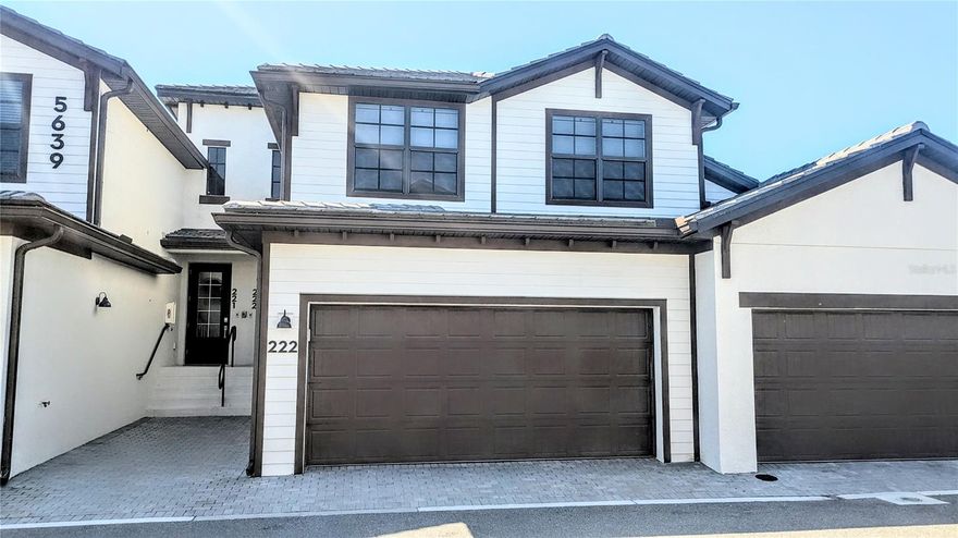 This spacious open floor plan features the main living area upstairs and a lower-level 2-car garage with extra storage. This 3-bedroom, 2-bath home is beautifully furnished with modern décor throughout. The kitchen offers solid quartz countertops, new stainless steel appliances, a breakfast bar, a large pantry, and solid wood cabinetry. The open layout makes entertaining a breeze, especially with the screened-in lanai overlooking the pond. Tile flooring runs throughout the common living areas, while the bedrooms are carpeted for comfort. The primary bedroom is tastefully decorated and includes direct access to the lanai, two large walk-in closets, and an en-suite bathroom with dual vanities and a walk-in shower. One guest bedroom is fully furnished, while the second is currently used as a dressing room but can easily be converted back to a bedroom. The Montserrat community offers a pool with a cabana for residents to enjoy. Call today for your change in the weather!