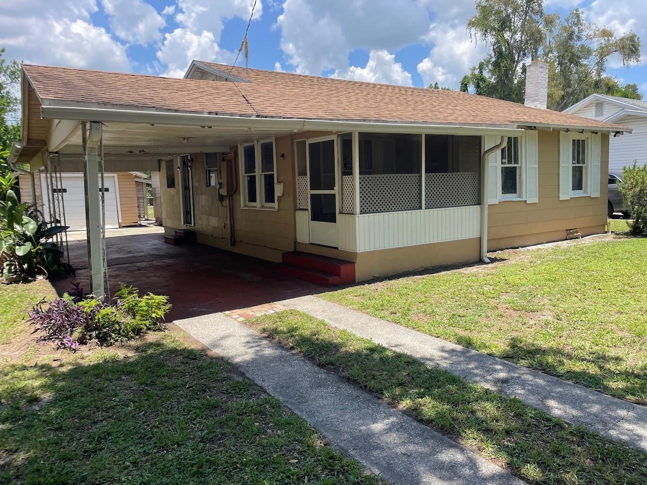 This charming 3 bedroom, 2 bath bungalow offers plenty of potential. Fall in love with the unique opportunity to own and restore the rich character of a 1940s vintage gem. The large .26 acre lot will certainly attract the growing family, first-time buyer, and/or investor. The attached 13x36 carport leads you to the detached 17x20 garage/workshop, plus a nice-big fenced backyard for entertaining, gardening, pets, or even a pool!!! This historic bungalow has original hardwood floors, built-ins, eat-in kitchen and breakfast bar, plus a seperate dinning room. Enjoy 3 generously sized bedrooms, 2 full bathrooms, lots of closet/storage space and expansive windows throughout, creating lots of natural lighting and inviting spaces. Quick-easy access to Downtown Lakeland, Lakeland High School, Southeastern University and Florida Southern College. Walking distance to Interlachen Park, Lake Bonny Shore and Lake Parker. This timeless-bungalow is ideal for the vision-buyer who appreciates classic-craftsmanship with modern comforts.