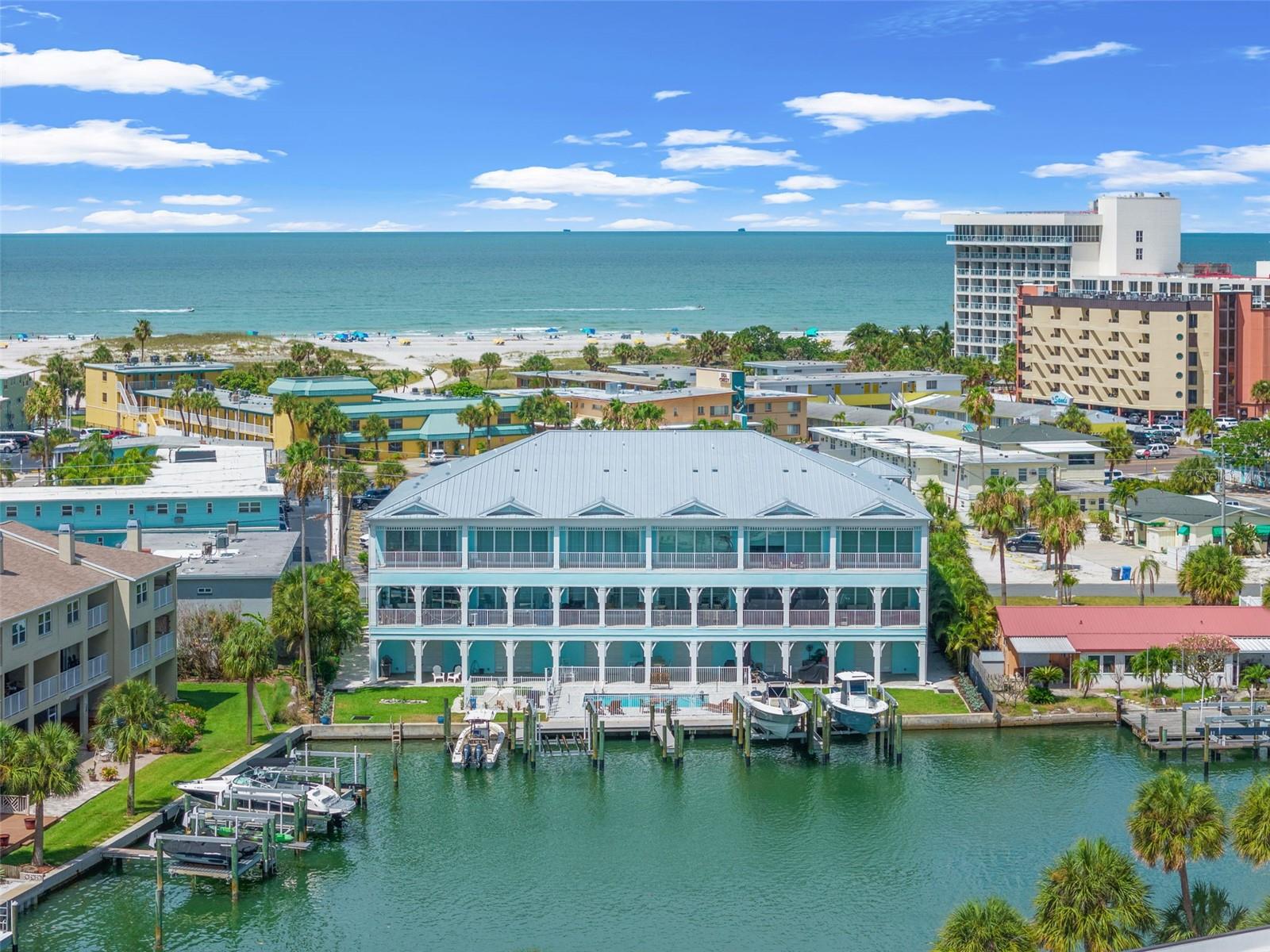 Everything you’ve been dreaming of in a coastal home — and then some!
This Key West–style townhome is all about easy, breezy island living with a private elevator, a fenced backyard, pool, and your very own 100' composite dock with deeded boat slip. From the Intracoastal to the Gulf of Mexico and those famous sugary white sand beaches, the views set the stage for the ultimate Florida lifestyle.
Let’s start at ground level. The oversized garage is a dream in itself — plenty of room for cars, toys, workshop space, and built-ins to keep everything tidy. Step outside to the pavered carport, patio, or head straight to the dock and heated pool for a sunset dip.
On the main floor, it’s all about entertaining. The gourmet kitchen is truly a showstopper with a gas stovetop, Cafe appliances, floor-to-ceiling lighted cabinets, custom pullout shelving, and an oversized granite island that begs for friends and family to gather around. A glass-tiled backsplash and walk-in pantry with whole-house filtration system tie it all together. The open-concept dining and living space flow seamlessly to an expansive balcony — complete with hurricane-rated pocket sliders, Hunter Douglas remote electric shades/screens throughout, and porcelain flooring that makes indoor-outdoor living effortless. Bonus: a guest bedroom (or office) with Gulf views and a full bath right on this level.
Upstairs is where you’ll retreat. A guest suite, custom closet, private balcony, and spa-like ensuite makes overnight stays easy. The laundry room is thoughtfully designed with custom cabinetry and sink. And then there’s the primary suite — a true sanctuary. Ten-foot pocket sliders with blackout shades frame jaw-dropping water views and open to your oversized balcony. Two custom walk-in closets (one with walk-up attic access), storage galore. The ensuite bathroom feels like a spa with quartz-topped dual sinks and river rock flooring.
And because location matters — John’s Pass is just minutes away, giving you quick access to world-class fishing, dining, and entertainment.
This home is loaded with thoughtful upgrades: whole-home professional wiring with internet boosters, water softener, and a whole-house filtration system.
Florida living doesn’t get better than this — and it’s ready for you.
