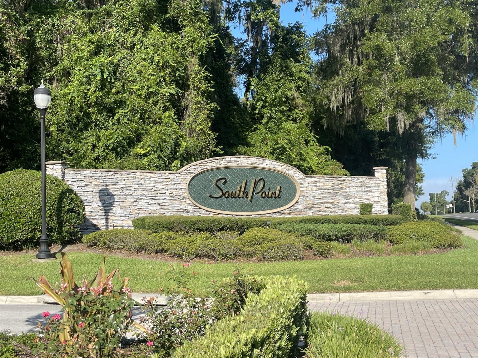 Offering 1.12 acres of wooded beauty, this South Point parcel provides ample space for an impressive custom residence, in keeping with the community’s 3,500+ square foot minimum home size. Located near the stately gated entrance, yet privately placed on a side road, this property strikes the perfect balance of prestige and privacy. With manicured grounds, deed restrictions that protect long-term value, and a prime Southeast Ocala location, this lot is ready for your vision to take shape. Neighboring parcels are available for purchase, providing the opportunity to create a larger estate tailored to your vision. These three contiguous wooded parcels—1.00, 1.10, and 1.12 acres—can be purchased separately or combined to create an extraordinary estate.