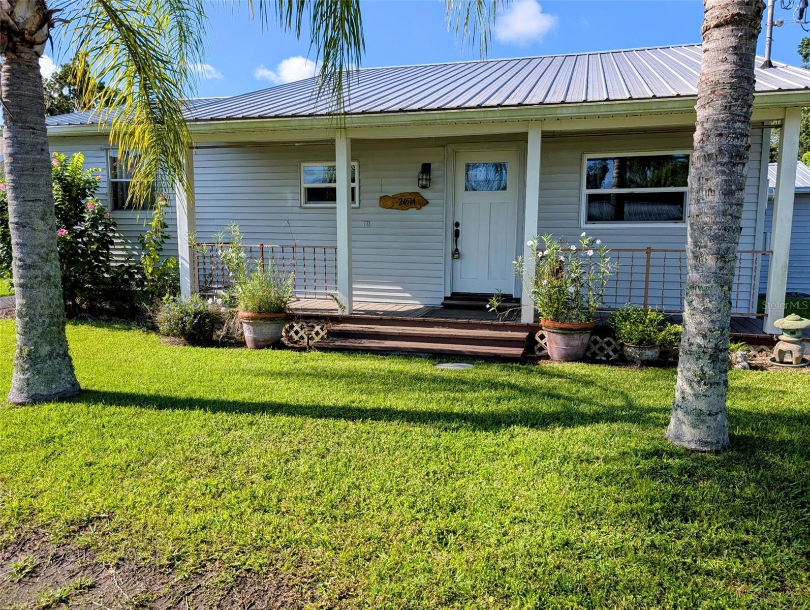 This beautifully updated 2/3 home offers comfort, convenience, and a host of premium features for Florida living at its best! Enjoy a new metal roof, asphalt driveway, and a carport for easy parking with a 2nd driveway on other side of house. Step inside to discover luxury vinyl laminate flooring, granite countertops and veneer plaster walls that give this home a clean and modern feel.
The property boasts new electrical, new plumbing and new ductwork in the attic, ensuring peace of mind and efficiency. You'll love the huge walk-in shower and soaking tub in the master bathroom. Mini split system, and plenty of storage inside and out side.
For outdoor living, relax in the screened back porch, or sit on the front porch and enjoy the neighbors. There is also a fenced in area to secure the safety of your pets.
Boaters will love the aluminum seawall and private boat house with lift.
Also 2 Storage sheds one has a a/c window unit great for a work shop.