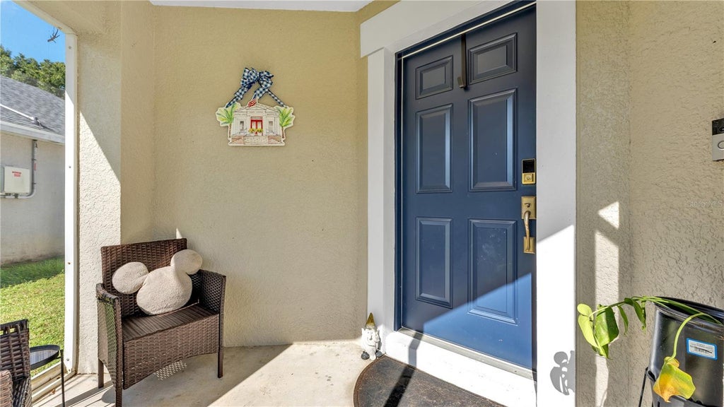 Photo of 815 Windsor Estates Dr, Davenport, FL 33837 (MLS # L4965295)