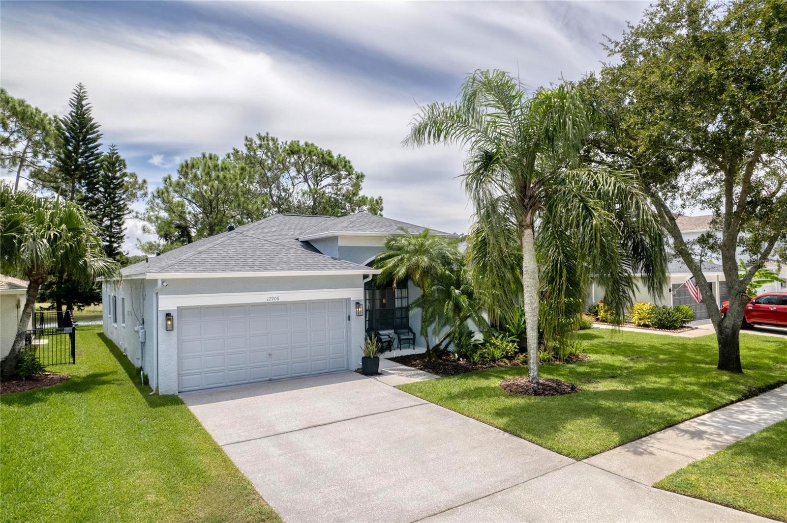 One or more photo(s) has been virtually staged. Showstopper Home, Recently Updated, in the Eagles zoned for all A Rated Bryant, Farnell and Sickles Schools!
Experience Florida living at its finest in this beautifully updated 3-bedroom, 2-bath, 2-car garage home with tranquil pond views and no rear neighbors. Set within the gated golf community of The Eagles, this home has been thoughtfully enhanced with high-end finishes and modern upgrades throughout.
Step inside and you'll immediately notice the wide luxury vinyl plank flooring ($7,500), crown molding, wide baseboards, and smooth ceilings—popcorn ceiling texture has been removed throughout ($1,000). The open layout is accentuated by shiplap ceilings ($4,500), updated fans, stylish light fixtures ($2,000), and fresh interior paint ($1,500), creating a warm and inviting atmosphere.
The kitchen has been completely redesigned and fully updated with soft-close cabinets and pantries ($20,000), marble countertops ($6,500), stainless steel appliances by KitchenAid and LG ($5,000), a custom backsplash with a stainless-steel vent hood, and a shiplap-wrapped lower cabinet feature. A reverse osmosis system adds convenience and clean drinking water straight from the tap.
Both bathrooms have been tastefully updated. The primary suite features floating plantation shutters ($1,000), a reglazed shower, under-the-counter pullout drawers, updated lighting, and a shiplap accent wall. The second bath boasts granite countertops, an upgraded vanity, and modern lighting.
The living area is anchored by custom draperies, new blinds ($1,200), and an electric fireplace—perfect for cozy evenings. The sliding glass doors are outfitted with updated shades and open to a screened lanai that was recently pressure washed. The exterior has also been refreshed with new front landscaping and privacy plants in the backyard, which has plenty of space for a pool.
Functional upgrades include a new roof (2021), new AC unit (2021), newer tankless water heater (2022), water softener (2023), and relocation of the AC unit to the garage for added efficiency. Overhead storage racks were also installed in the garage. A newer hot tub conveys with the home, offering the perfect place to unwind and take in the peaceful water views.
Located within the highly sought-after, guard-gated community of The Eagles, residents enjoy 24/7 security, two championship golf courses, a clubhouse, on-site restaurant, basketball courts, and scenic green space. With low HOA fees ($132/month) and no CDD fees, this community delivers exceptional value. Zoned for top-rated schools (Mary Bryant, Farnell, Sickles) and just minutes from premier shopping, dining, Tampa International Airport, and world-class beaches—this home is the perfect blend of luxury and location.