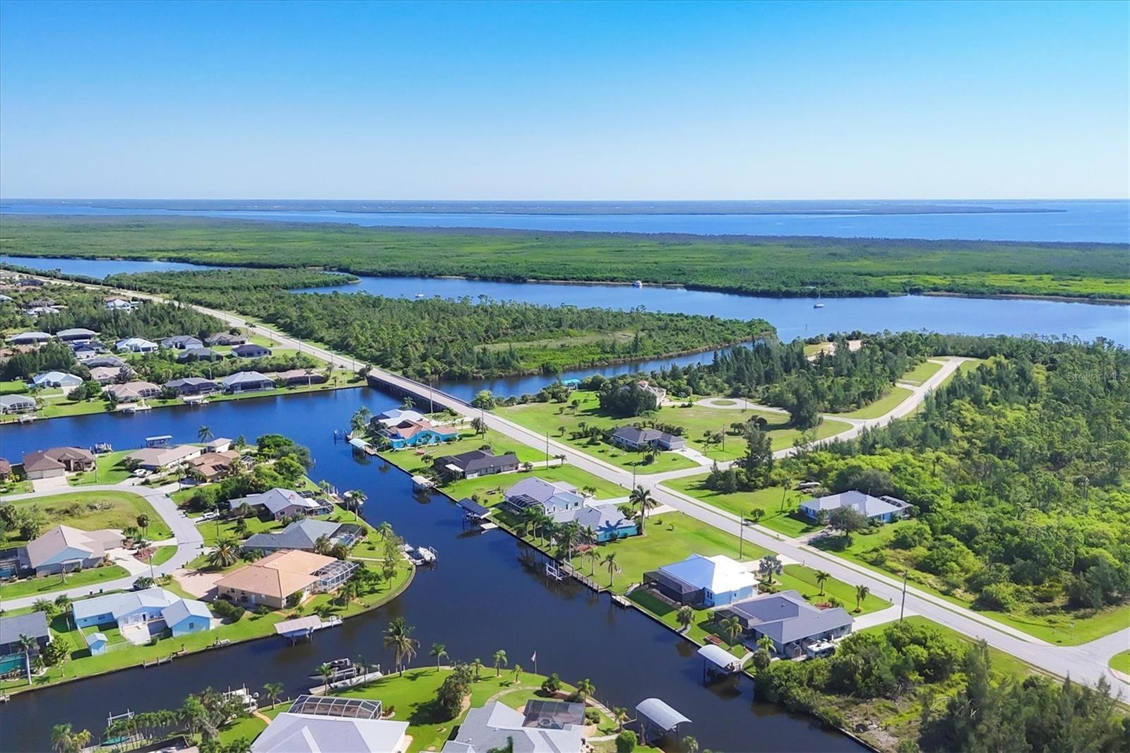 Welcome to 9349 St. Paul Drive, a waterfront gem in the sought-after South Gulf Cove community of Port Charlotte. This 3-bedroom, 2-bathroom home spans 2,141 square feet and boasts one of the best locations off the Main Zephyr Waterway—just one bridge out to open water, making your boating days effortless and exciting.
Inside, the thoughtful layout separates the guest bedrooms from the primary suite, offering privacy and comfort for family or visitors. The guest bathroom provides direct access to the lanai, perfect for poolside convenience. With both a living room and a family room, plus a bonus space ideal for an office or craft room, the home delivers versatility to fit your lifestyle.
Function meets practicality with a 2-car garage, two 7x7 outdoor sheds on a stone pad for extra storage, an RV hookup, and a backup generator wired directly to the panel. Updates include a newer roof, new lanai cage, new AC and air handler, new hot water heater, and fresh exterior paint in 2022. The kitchen features a new refrigerator, with an additional one located in the garage.
Step outside to a spacious west-facing lanai built for relaxation and entertaining, with defined seating and dining areas, an outdoor shower, and a heated chlorine pool with spa. A cement pad off the lanai offers the perfect spot to soak in Florida’s unforgettable sunsets. The property includes a concrete seawall, a dock with water and electric, and a newer covered 10,000 lb. boat lift, all set along a cement walkway that enhances waterfront access.
Low-maintenance landscaping means less yard work and more time to enjoy everything this area has to offer—world-class fishing in Charlotte Harbor and Boca Grande, boatable restaurants, top-rated golf courses, and incredible Gulf beaches. The home also features Bluestream internet and a transferable flood insurance policy for added peace of mind.
This is Florida living without compromise—priced right and ready to deliver the paradise lifestyle you've been searching for.