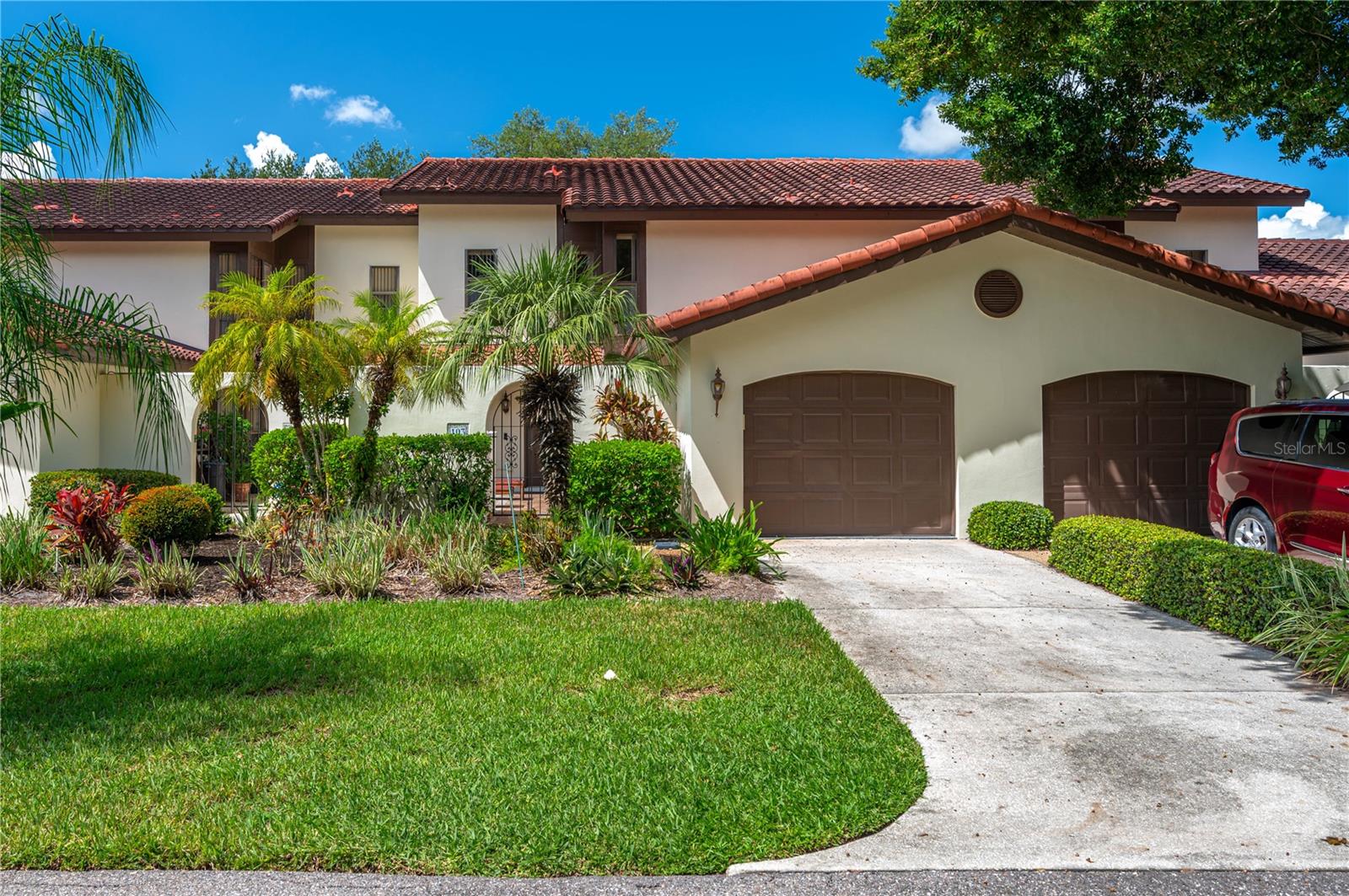 Welcome to this secluded townhouse located in the serene Grenelefe Club Estates community. This 3-bedroom, 3-bathroom home offers 1,844 square feet of comfortable living space and features both a front 1-car garage and a rear garage—perfect for your golf cart or extra storage. Step inside to an expansive open floor plan that seamlessly connects the kitchen, dining area, and family room, creating the ideal space for entertaining guests. The family room showcases cathedral ceilings and skylights, allowing natural light to pour in and enhancing the bright, airy atmosphere. The kitchen is both stylish and functional, complete with tile countertops and stainless steel appliances.
On the first floor, you’ll find a secondary primary suite with its own en suite bathroom, providing a perfect retreat for guests, as well as a second full bathroom with an updated shower conveniently located near the entryway. Upstairs, the primary suite offers a luxurious en suite bathroom featuring a walk-in shower and a relaxing garden tub. A spacious loft overlooking the living area provides versatility—it can easily serve as a third bedroom, office, or cozy den.
Enjoy peaceful mornings and relaxing evenings in the spacious screened-in back porch, surrounded by mature oak trees that provide generous shade and a tranquil outdoor setting for coffee, grilling, or quiet reflection. The community amenities include a beautiful clubhouse with a fully equipped kitchen, a sauna, separate locker rooms with showers, a small gym, and a screen-enclosed pool and hot tub with ample seating for lounging and socializing.
Centrally located near the I-4 corridor, this home offers easy access to both Orlando and Tampa, making it perfect for those seeking convenience and comfort. All measurements are approximate; buyers or their agents should verify measurements, HOA, and property details. Submit on the FAR/BAR 7 AS-IS contract with proof of funds or pre-approval. Don’t miss this opportunity to experience the best of Florida living—schedule your private showing today!