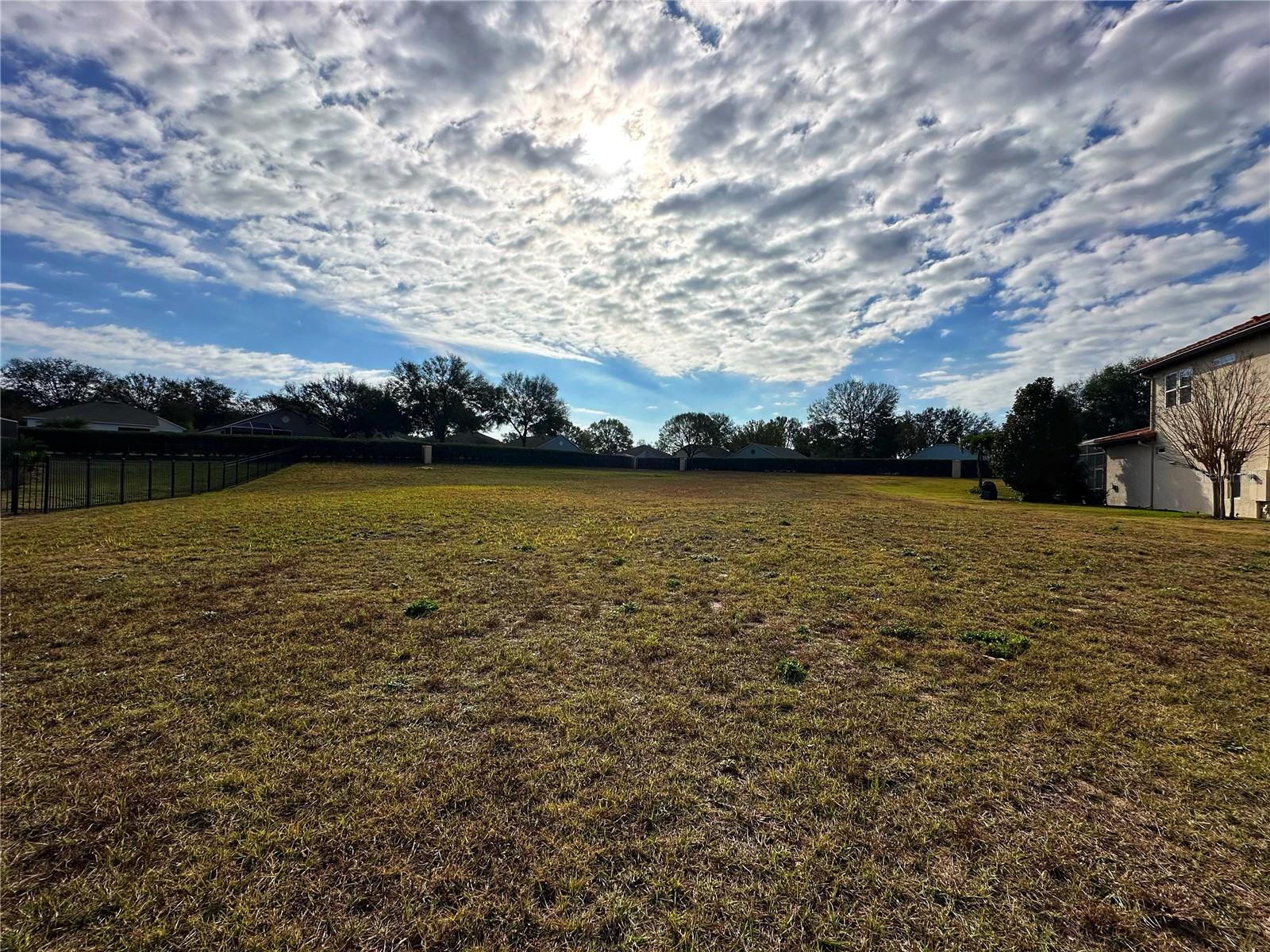Build your dream home in the distinguished Bella Lago, a private gated community! This oversized half acre corner lot provides the ultimate privacy and is located at the highest point in the neighborhood. The community offers breathtaking sunsets, private fishing dock on Lake Felter, and a playground area. Bella Lago is close proximity to downtown Clermont, hwy 50, dining, shopping, hospitals, schools, parks and 35 minutes from Disney. There is natural gas, public sewer and high speed internet available. This is the last lot so schedule your showing now and start building your dream home!