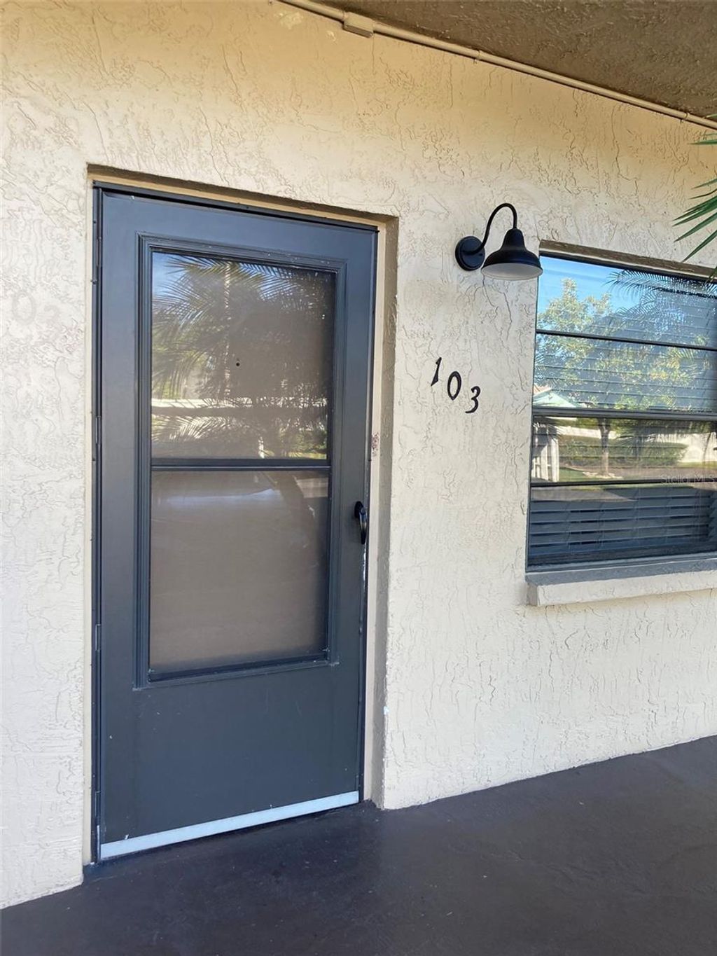 Photo of 5975 N Terrace Park Drive N #103, St Petersburg, FL 33709 (MLS # TB8463786)