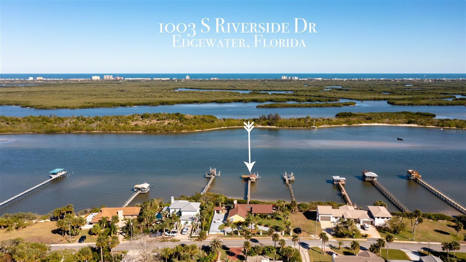STOP Wishin' and START Fishin’! Enjoy your dream life on the beautiful Intracostal Waterway of Florida’s East Coast. For the Buyer who seeks peace, quiet, nature and the best Red Fishing in the world renowned Mosquito Lagoon or a quick boat ride north to Ponce Inlet. This gorgeous intracoastal-front home is located on the northern edge of the Canaveral National Seashore and southern tip of New Smyrna Beach. Cast a line into pristine waters from your private 150 ft dock; complete with covered seating area, spacious platform, 2 boat lifts (2500 & 6500 lb capacity), utility sink & fish cutting station. Watch dolphins play in the wake of sailboats cruising past. Leave your boat and jet skis right in your backyard. This tranquil waterway transports you to the Florida of yesteryear, just minutes from sandy beaches and amenities of New Smyrna Beach. This area is a hidden gem, located directly on the ICW with 120 riverfront footage. The 1,864 sq ft home (totaling 4,060 sq ft indoor/outdoor living space) offers 3 bedrooms, 2 baths, built-in wine cooler, stainless steel appliances, coffee bar & bar. White washed walls, chic beach flooring and backsplashes make for a fun vibe. Entertain your guests on 1,700 sq ft waterfront deck, complete with 2 Napoleon propane grills, oversized propane burner, kegerator, ice maker, custom Brazilian cabinetry, sink with cutting board & granite countertops. Open up the custom tiki bar and enjoy cocktails with friends & family. The large circular driveway with gated entrances has ample room for parking. A fully fenced property makes this home feel truly private & protected. 2 car garage fully air-conditioned with custom shelving throughout. Roof was replaced in 2017, and exterior of home was fully painted vibrant “Naples Yellow” in 2022, enhanced by mature lush tropical landscape with privacy hedge. This home is a one-of-a-kind, double lotted gem in one of the best neighborhoods just south of New Smyrna Beach. Be sure to see our virtual tour! ;Water: City