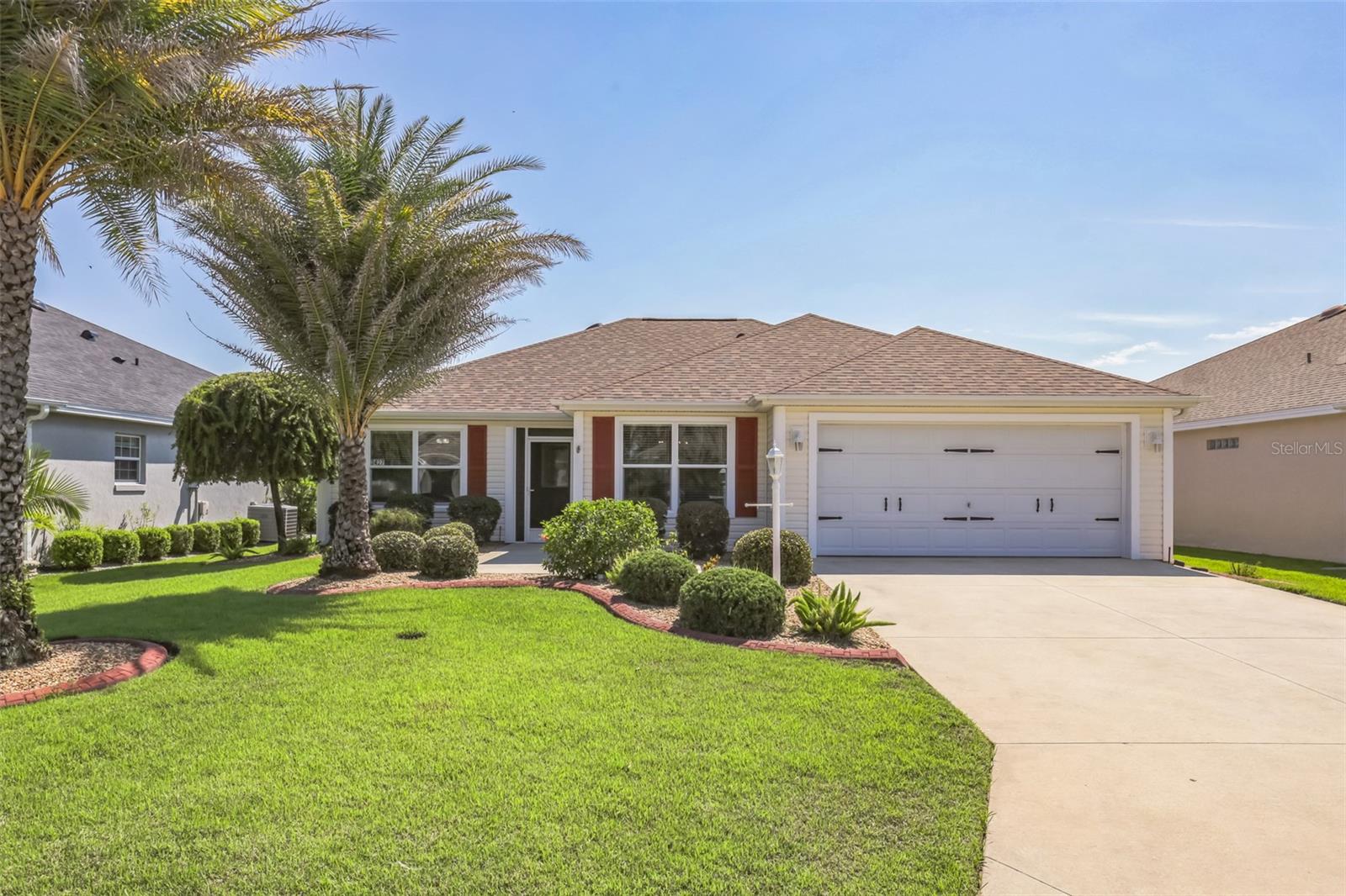 Welcome to this Wisteria Model Designer home in the highly sought after Village of Collier-Just a 5-minute golf cart ride to Brownwood Square as well as shopping and restaurants AND within walking distance to Eisenhower Recreation Center,pools and sports courts. The Lifestyle doesn’t get any more convenient than this. This well kept home is immaculately landscaped and features mature bottle brush and palm trees. The convenient split floor plan featuring a private wing for guests, along with the added breakfast ‘nook’ in front of the kitchen makes this model one of the most popular in The Villages. Add a 6-person Bullfrog hot tub in an expanded birdcage off the already large main lanai, plus a Queen size Murphy bed and cabinets built into the front bedroom/office and you’ve got even more value added. Factor in the added solar tube, brand NEW stainless steel appliances, NO carpets, a low bond, a NEW roof in 2025 and this already attractively priced home will not last long!
Some features include:
-New Roof April 2025
-New Water heater 2023
-Brand New LG/Samsung Stainless Steel Appliances
-Bullfrog Model A6L hot tub-6 person included with an expanded Birdcage
-Full Queen Murphy bed and side nightstands built into the front bedroom
-Interior is 100% Freshly painted and garage floor newly epoxied
-Expanded 2 car garage (stretched forward 2’ making it 20 x 23’)
-NO carpet
-Enhanced landscaping featuring THREE palm trees
-Great private designer neighborhood behind Eisenhower Rec Center and 5 minutes to Brownwood by golf cart
-Low Bond
-Solar Tube
REALTORS READ NOTES PLEASE.