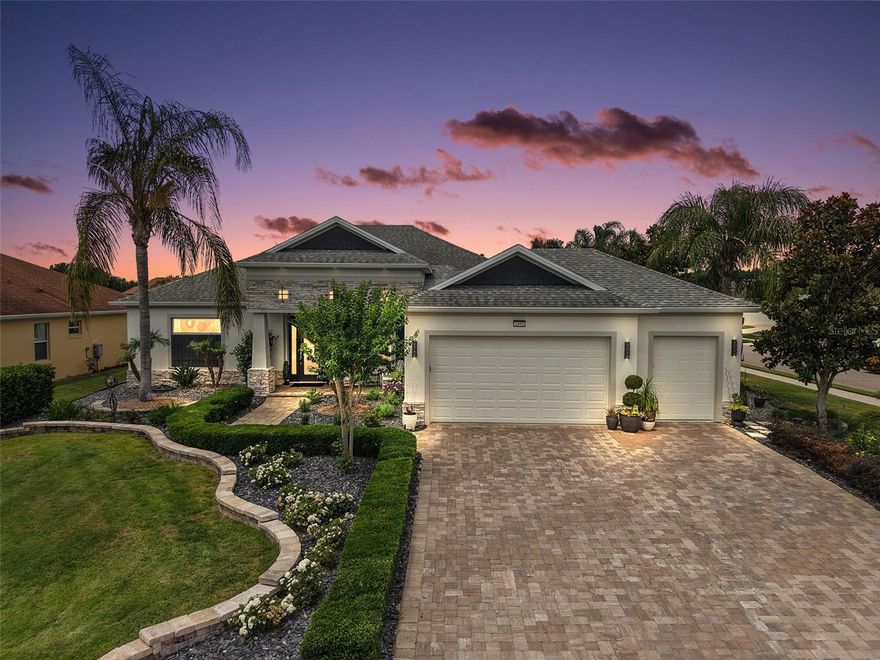 Welcome to this exceptional former model home in the highly sought-after Lakes of Mount Dora.  This home has a thoughtful design, upscale finishes, and resort-style outdoor living with heated saltwater pool, screened enclosure, built in gas grill and extended covered lanai! From the moment you arrive, the curb appeal, professional landscaping, the expanded garage space and 1/3 acre corner lot, set the tone for what awaits inside. The newly added separate one-car garage provides incredible flexibility for a golf cart, workshop, storage, or hobby space. Built with an abundance of upgrades and designer touches, this Medallion Palm Island former Model home showcases elegant volume ceilings, engineered hardwood flooring throughout and tasteful architectural details Double front doors with privacy glass welcome you into the elegant entry foyer accented with marble tile details. The open dining room flows seamlessly into the spacious living area, which features raised wood ceiling accent, built-in bookcases, an electric fireplace, and an inviting layout perfect for both everyday living and entertaining. The gourmet kitchen overlooks the living room with breakfast bar, granite countertops, marble backsplash, newer Bosch dishwasher, built in oven and microwave, induction cooktop with vented hood, Samsung Chef collection refrigerator, walk in pantry and a built-in bench seat providing additional seating. The Family/flex room is thoughtfully designed for entertaining, featuring built-in cabinetry and countertops, a stylish wet bar area with underlit countertops, a bar sink, ice maker, mini refrigerator, and wine cooler. The primary suite offers a peaceful retreat with tray ceiling, door leading to the pool and an ensuite spa-inspired bathroom features a soaking tub, walk in shower dual sinks, private water closet & large walk-in closet. The guest spaces provide privacy and flexibility. The third bedroom is currently being used as a beautifully designed office with custom built-in desks, creating the ideal work-from-home setup while still offering the versatility of a bedroom if desired. Both the living room and Family room feature pocket sliding doors that open seamlessly to the pool and covered lanai area, creating an indoor-outdoor living experience. Step outside to your own private backyard oasis, where the current owner added a stunning custom heated saltwater pool complete with a sun shelf and soothing water feature, creating the perfect setting to relax or entertain year-round. The screened lanai is designed for effortless outdoor living, featuring a built-in 32-inch grill and sink, making it ideal for hosting gatherings, dining al fresco, or simply enjoying Florida’s beautiful weather. Other features include HVAC 2 years new, Pest tubes, security system, rain gutters, transferrable termite bond. Located in the 55 + gated, waterfront community of Lakes of Mount Dora, residents enjoy an incredible lifestyle with amenities including a clubhouse, pool, library, billiard room, fitness center, trails, tennis, pickle ball and shuffle ball courts. Cable, internet, trash and irrigation included in the HOA. Just minutes from charming downtown Mount Dora with its restaurants, shops, festivals, and waterfront parks, this home offers the perfect blend of luxury, comfort, and convenience. Orlando, theme parks and beaches are just a short drive away via Wekiva Parkway and 429 connectors.
Some furnishings are negotiable.