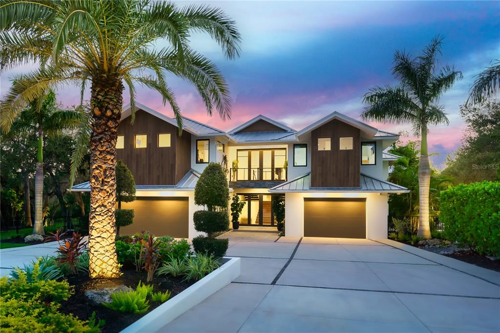 One-of-a-kind spectacular waterfront masterpiece in the heart of Sarasota! This mature landscaped estate is nestled on 1.47 acres and completely private in a small, gated community with only eight homes. Boasting 5 bedrooms and 5.5 bathrooms this custom coastal contemporary home was built with meticulous craftsmanship and bespoke finishes throughout. The main level features an open floor plan with 23-foot soaring ceilings and wide plank oak flooring throughout. Beautifully appointed gourmet kitchen has a spacious kitchen island with top-of-the-line Subzero and Wolf appliances. Step into the luxurious living room while overlooking this stunning property. The vast butler's pantry and laundry room are hidden and conveniently located in the center of the home.
Peaceful owner’s suite replete with two walk-in custom closets, spa-like bathroom with dual vanities, hidden TV in the mirror, walk-in shower, soaking tub, and slider that lead outside.
Upstairs, two en-suite bedrooms and a workout room. An additional en-suite bedroom is located on the main floor with an additional bedroom at the back of the home.
The lavish interior flows effortlessly to the breathtaking outdoors perfect for entertaining with a fully equipped outdoor kitchen bar area, fireplace, and heated saltwater infinity pool. Walk down to the 2 cabana areas that are equipped with an additional grill. Looking to enjoy some time on the water? Stroll down to your private oversized dock that features a 16,000lb boat lift and a 10,000lb dual jet ski lift. The dock is fully equipped with shore power, fresh water, and lighting. Take a cruise down Philippi creek to Sarasota Bay.
Other highlights of this property include outdoor landscape lighting, a hidden wet bar with a wine refrigerator, art gallery hallways, a mud room with a dog shower and automatic water bowl, 3 car attached garage, custom designed driveway with ample parking for entertaining, a security system, speaker system, and an outdoor shower & bathroom.
This captivating jewel is a must-see it to believe it and once you do…. Life will never be the same. Room Feature: Linen Closet In Bath (Primary Bedroom).