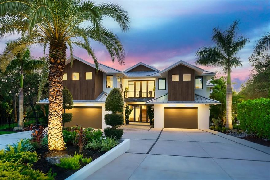 One-of-a-kind spectacular waterfront masterpiece in the heart of Sarasota! This mature landscaped estate is nestled on 1.47 acres and completely private in a small, gated community with only eight homes. Boasting 5 bedrooms and 5.5 bathrooms this custom coastal contemporary home was built with meticulous craftsmanship and bespoke finishes throughout. The main level features an open floor plan with 23-foot soaring ceilings and wide plank oak flooring throughout. Beautifully appointed gourmet kitchen has a spacious kitchen island with top-of-the-line Subzero and Wolf appliances. Step into the luxurious living room while overlooking this stunning property. The vast butler's pantry and laundry room are hidden and conveniently located in the center of the home. 
Peaceful owner’s suite replete with two walk-in custom closets, spa-like bathroom with dual vanities, hidden TV in the mirror, walk-in shower, soaking tub, and slider that lead outside. 
Upstairs, two en-suite bedrooms and a workout room. An additional en-suite bedroom is located on the main floor with an additional bedroom at the back of the home. 
The lavish interior flows effortlessly to the breathtaking outdoors perfect for entertaining with a fully equipped outdoor kitchen bar area, fireplace, and heated saltwater infinity pool. Walk down to the 2 cabana areas that are equipped with an additional grill. Looking to enjoy some time on the water? Stroll down to your private oversized dock that features a 16,000lb boat lift and a 10,000lb dual jet ski lift. The dock is fully equipped with shore power, fresh water, and lighting. Take a cruise down Philippi creek to Sarasota Bay. 
Other highlights of this property include outdoor landscape lighting, a hidden wet bar with a wine refrigerator, art gallery hallways, a mud room with a dog shower and automatic water bowl, 3 car attached garage, custom designed driveway with ample parking for entertaining, a security system, speaker system, and an outdoor shower & bathroom. 
This captivating jewel is a must-see it to believe it and once you do…. Life will never be the same. Room Feature: Linen Closet In Bath (Primary Bedroom).