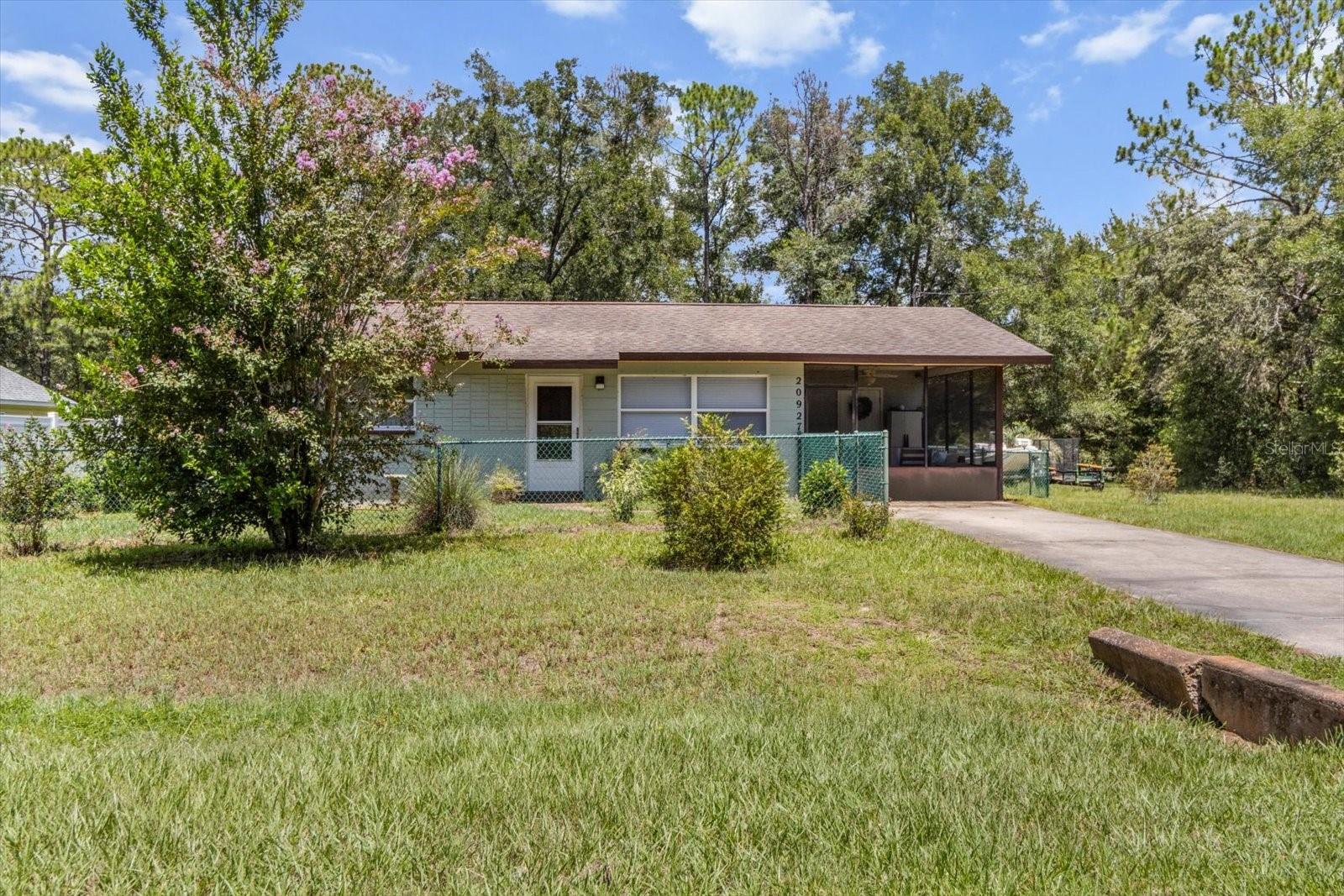 You have to come see this move in ready home in Rainbow Lake Estates. Recently remodeled and freshly painted with terrazzo floors that will knock your socks off. This home is clean, cozy and easy to maintain with it's comfortable and functional layout. The screened porch offers a nice outdoor space to relax and unwind any time of the day. The backyard has 2 sturdy sheds for your lawn equipment, extra storage or a great workshop. The property is completely fenced to keep your fur babies safe and sound while getting some outdoor time. The location is convenient to shopping, restaurants, outdoor activities while still be secluded enough to see the stars at night. Imagine star gazing and get togethers you can have here, relaxing with some friends. It's the perfect blend of country and city living. Rainbow Lake Estates has a community boat ramp and fishing pier. Go to the community center to socialize or play some tennis or racquetball. Does kayaking, paddle boarding or snorkeling interest you? Explore the beautiful Rainbow River appprox 7 miles up the road or Crystal River approx 20 miles away with water so clear you can see the bottom. Are you more of an equestrian person? The famous World Equestrian Center is approx 20 miles as well. You can always find something to do if you're looking. This little slice of paradise would make a great rental property as well. Call me to schedule a tour. I love showing this place off!!