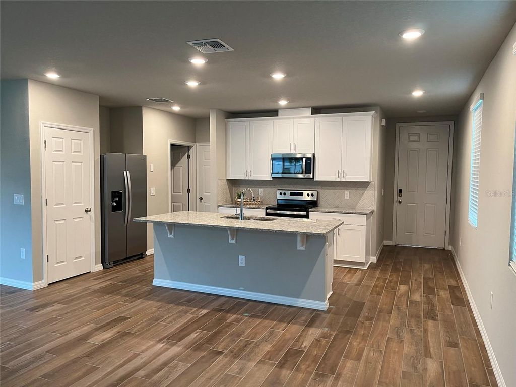 Photo of 437 Legacy Loop, Davenport, FL 33896 (MLS # O6409881)