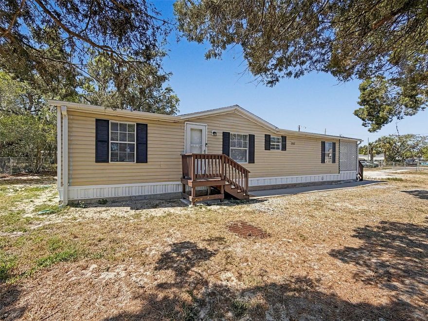 Beautifully remodeled 3 bedroom, 2 bath 1996 double wide mobile home PLUS crisp and clean 2 bedroom Guest House on spacious lot in Hudson, West Pasco County, Florida.  Enjoy living in a No Flood Zone environment but near great shopping and restaurants on US Hwy 19 or Little Rd., with an easy 35 minute drive to Tampa Airport.  The fully fenced property allows privacy and room for your pets to enjoy the Florida sunshine too!  The primary residence is fresh and clean, with vinyl plank flooring and upgraded kitchen and bathrooms.  The primary bedroom features a roomy en-suite bath, and is separated from the other 2 bedrooms by a wide open living & dining space, accessible from the big country kitchen.  The laundry is inside, and just past it is a door that leads to a deck that is screed and latticed for privacy that spans the end of the home.  The cozy 2 bedroom, 2 bath Guest House is currently rented and provides the owner with additional income to offset living expenses.  It has been remodeled too, and is in super condition, crisp paint, newer windows and AC unite, and many more useful upgrades.  The property is currently utilizing well water onsite, with hook ups to Pasco County water in the works.  It has 2 septic systems as well, so with County Water and no sewer charges, you have the best of both worlds!
If you are looking for a move-in ready home with added income, look no further!  Or, if you're an investor looking for long term rental investment, this is your opportunity  Don't delay.