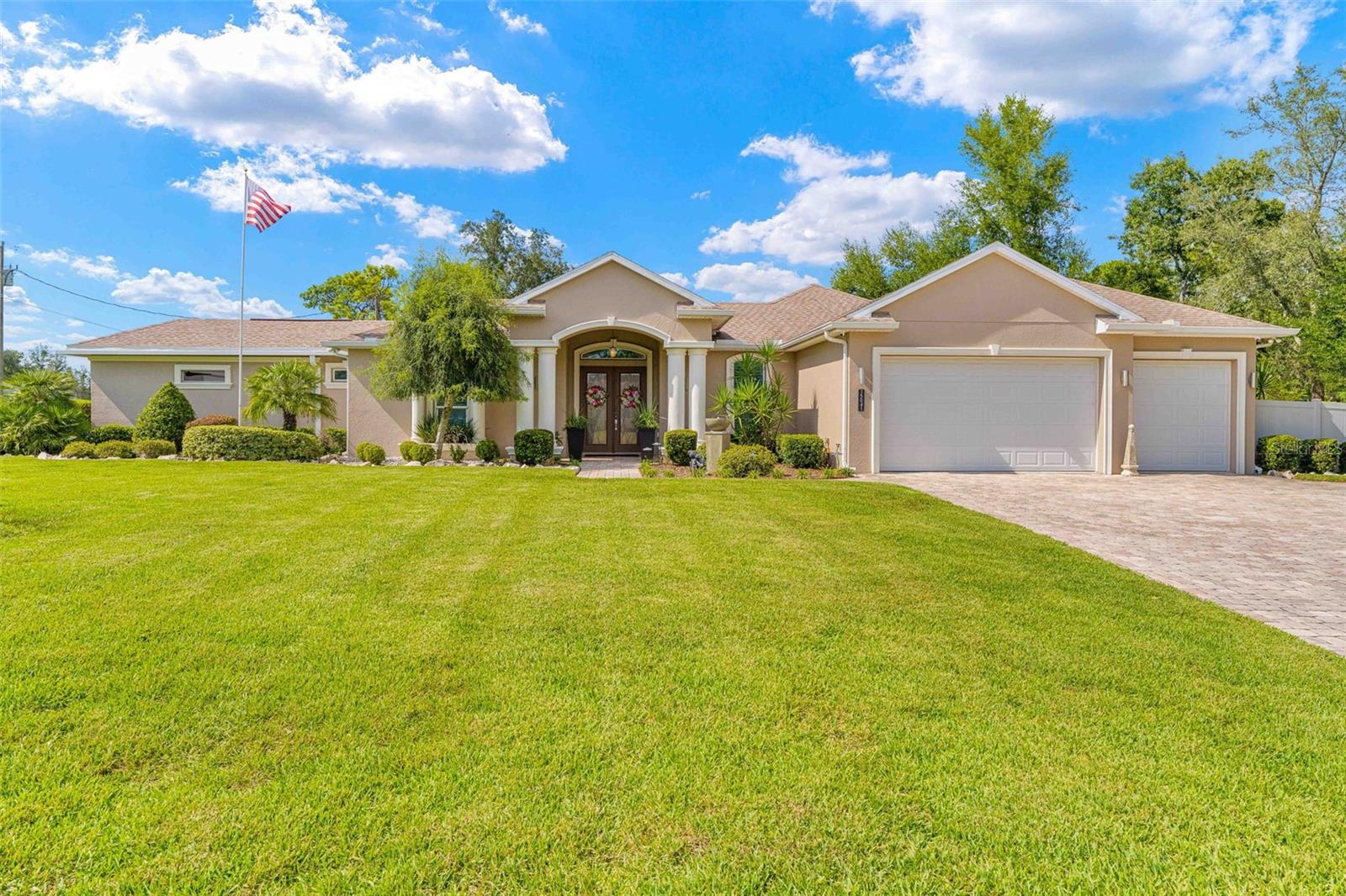MASSIVE PRICE REDUCTION! SELLERS HAVE LOCATED THEIR NEW HOME. LET'S MAKE A DEAL!
Stunning 10-Year-Old 3-Bedroom + Den, 4-Bath Cabana-Style Home with 3-Car Garage, Detached RV Garage & Additional 2-Car Garage
This exceptional 10-year-old home offers 3 bedrooms, 4 bathrooms, a kitchen with eat-in nook, living room, and family room—all designed for both elegance and comfort. The open-concept living space is highlighted by engineered hardwood flooring in the bedrooms and tile throughout all other areas. From the grand foyer, you’re welcomed by a custom-designed coffered ceiling and sliding glass doors framing serene views of the pool.
To the left of the foyer, the first guest bedroom features its own private en suite with wood cabinetry, granite countertops, and a fully tiled walk-in shower with glass sliding doors—perfect for guests seeking comfort and privacy.
The gourmet kitchen boasts stainless steel appliances, ample cabinetry, and a cozy breakfast nook. The spacious master suite is a true retreat, featuring a custom coffered ceiling with LED lighting, sliders leading directly to the pool, dual walk-in closets, and a luxurious en suite bath. The bathroom includes a jetted tub with a dedicated on-demand water heater, a dual-sink vanity with a gorgeous feature wall, and a fully tiled walk-in shower with one rainfall showerhead and two additional showerheads on separate valves for a spa-like experience.
Step outside to your private screened-in pool oasis, complete with a fully equipped outdoor kitchen featuring stainless steel cabinetry, built-in appliances, a separate sink, LED lighting, and a tongue-and-groove ceiling—completed in 2021. The outdoor bath is finished with stone counters, a wooden vanity, and a walk-in shower.
The laundry room is equipped with a washer/dryer set and a second washer built underneath the pedestal for added convenience.
Car lovers and adventurers will appreciate the attached 3-car garage, a detached 25x50 RV garage, and an additional detached 2-car garage—both built within the last few years—offering ample space for vehicles, boats, and workshop needs.
With its cabana-style layout, upgraded finishes, and meticulously maintained features, this property is a rare find. Schedule your private showing today and experience this exceptional home for yourself!