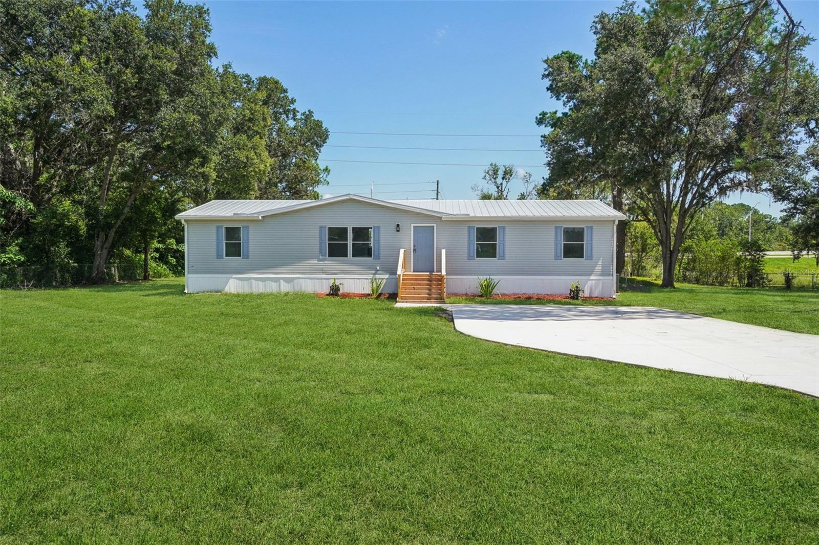4 Beds | 2 Baths | 1,680 Sq. Ft. | 1+/- Acre Lot | No HOA
Welcome to this fully renovated 4-bedroom, 2-bathroom home located in the heart of Wesley Chapel. Featuring 1,680 sq. ft. of bright, open living space, this home offers modern finishes and thoughtful updates throughout.
Highlights include:
- Brand new drain field and septic system
- Fresh interior and exterior paint with blue shutters and a metal roof
- Spacious backyard with a brand-new balcony, perfect for outdoor entertaining
- Large back yard deck and fresh landscaping
- Convenient access to I-75 and I-275
- No HOA or CDD fees
This move-in-ready home combines peaceful country living with a superior location. Schedule your showing today!