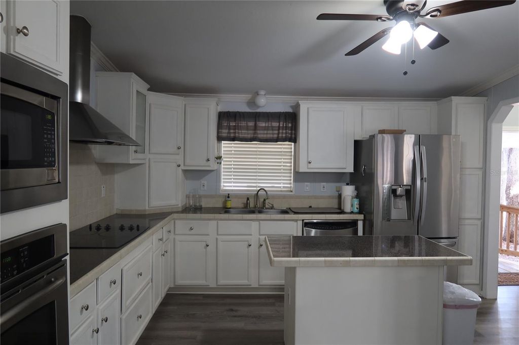 Photo of 25157 Buttonwood Drive, Astatula, FL 34705 (MLS # O6385175)